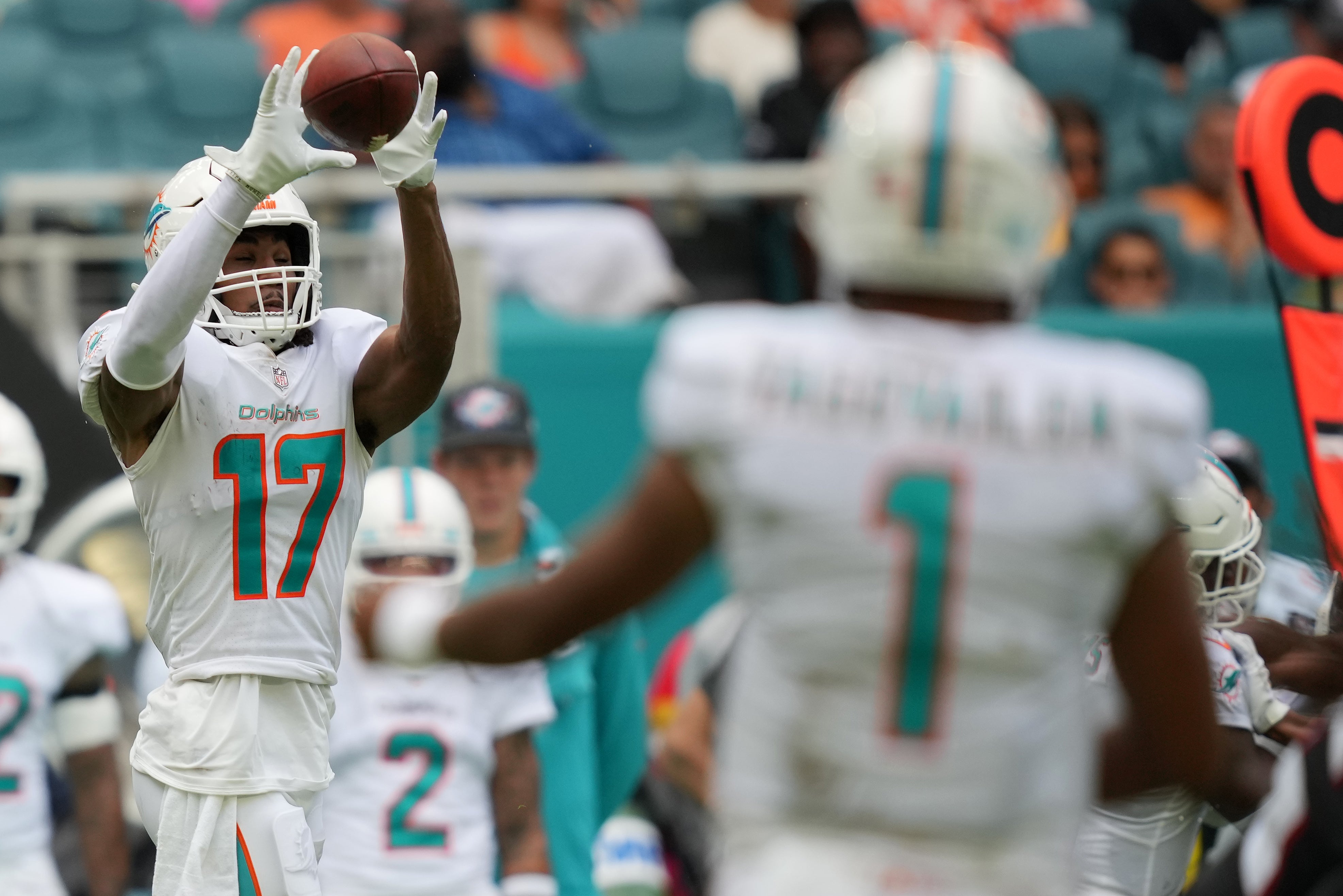 Oct 24, 2021; Miami Gardens, Florida, USA; Miami Dolphins wide receiver Jaylen Waddle (17) catches a pass from quarterback Tua Tagovailoa (1) during the first half against the Atlanta Falcons at Hard Rock Stadium.