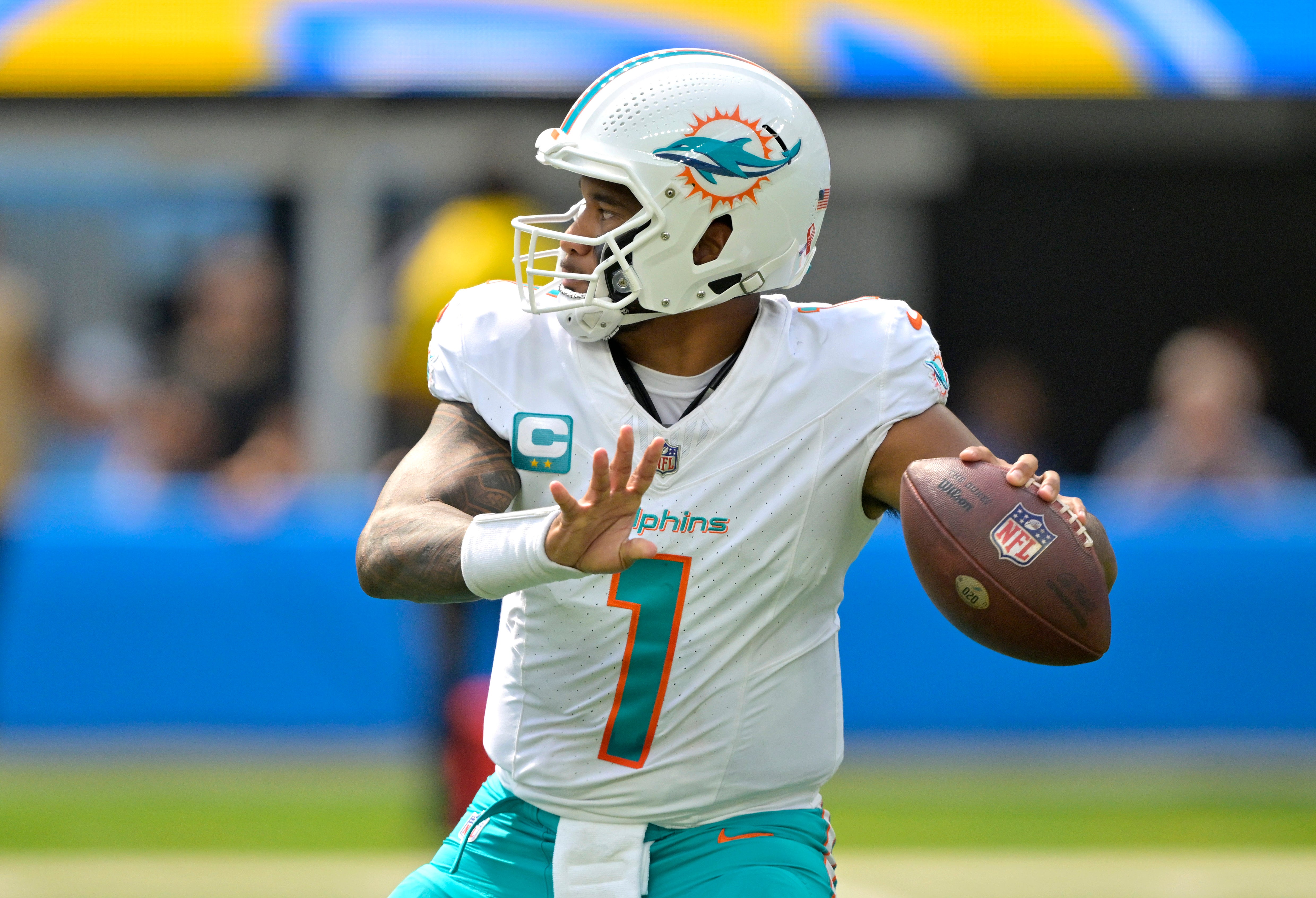 Sep 10, 2023; Inglewood, California, USA; Miami Dolphins quarterback Tua Tagovailoa (1) sets to pass in the first half against the Los Angeles Chargers at SoFi Stadium.