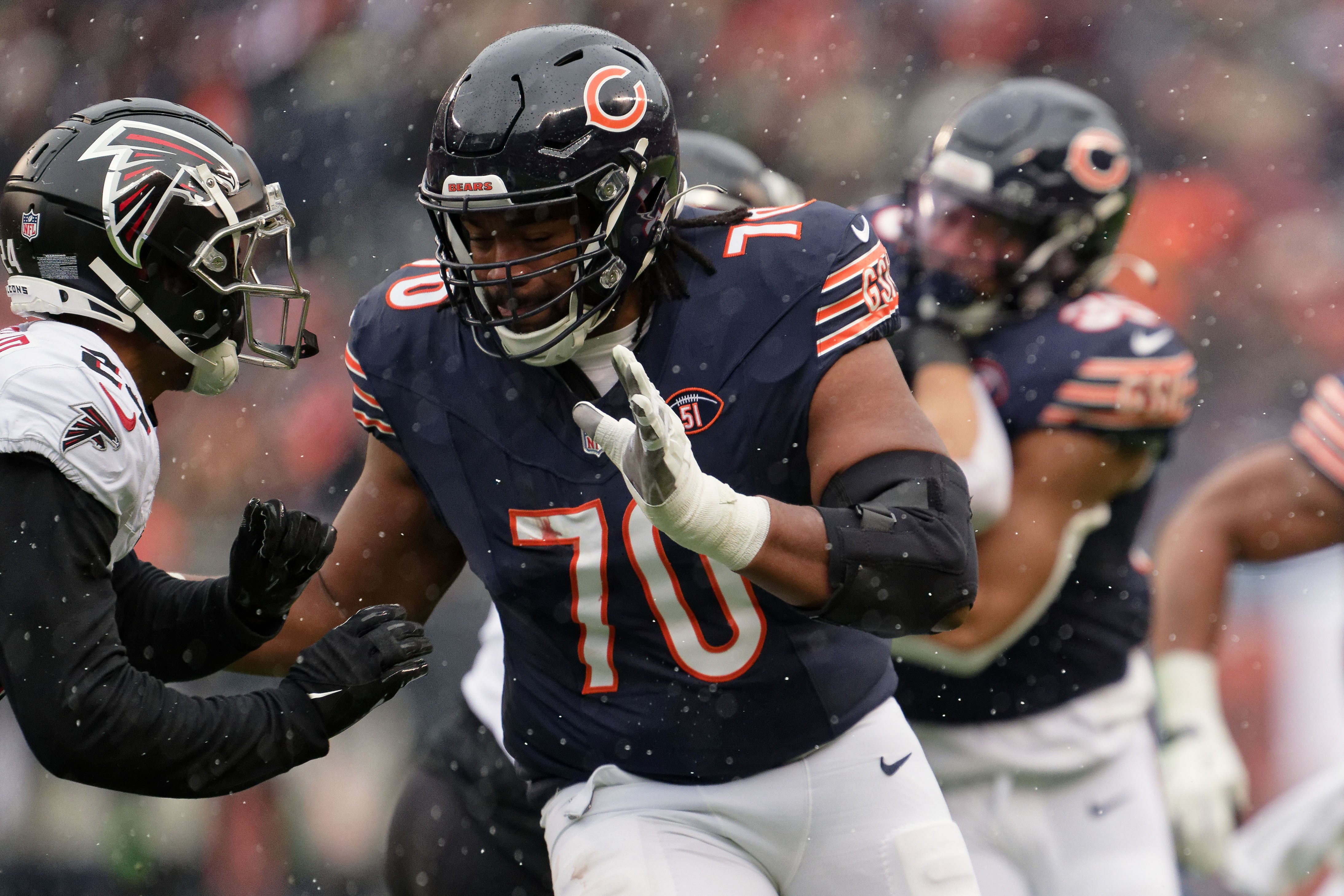 Dec 31, 2023; Chicago, Illinois, USA; Chicago Bears offensive lineman Braxton Jones (70) blocks against the Atlanta Falcons at Soldier Field.