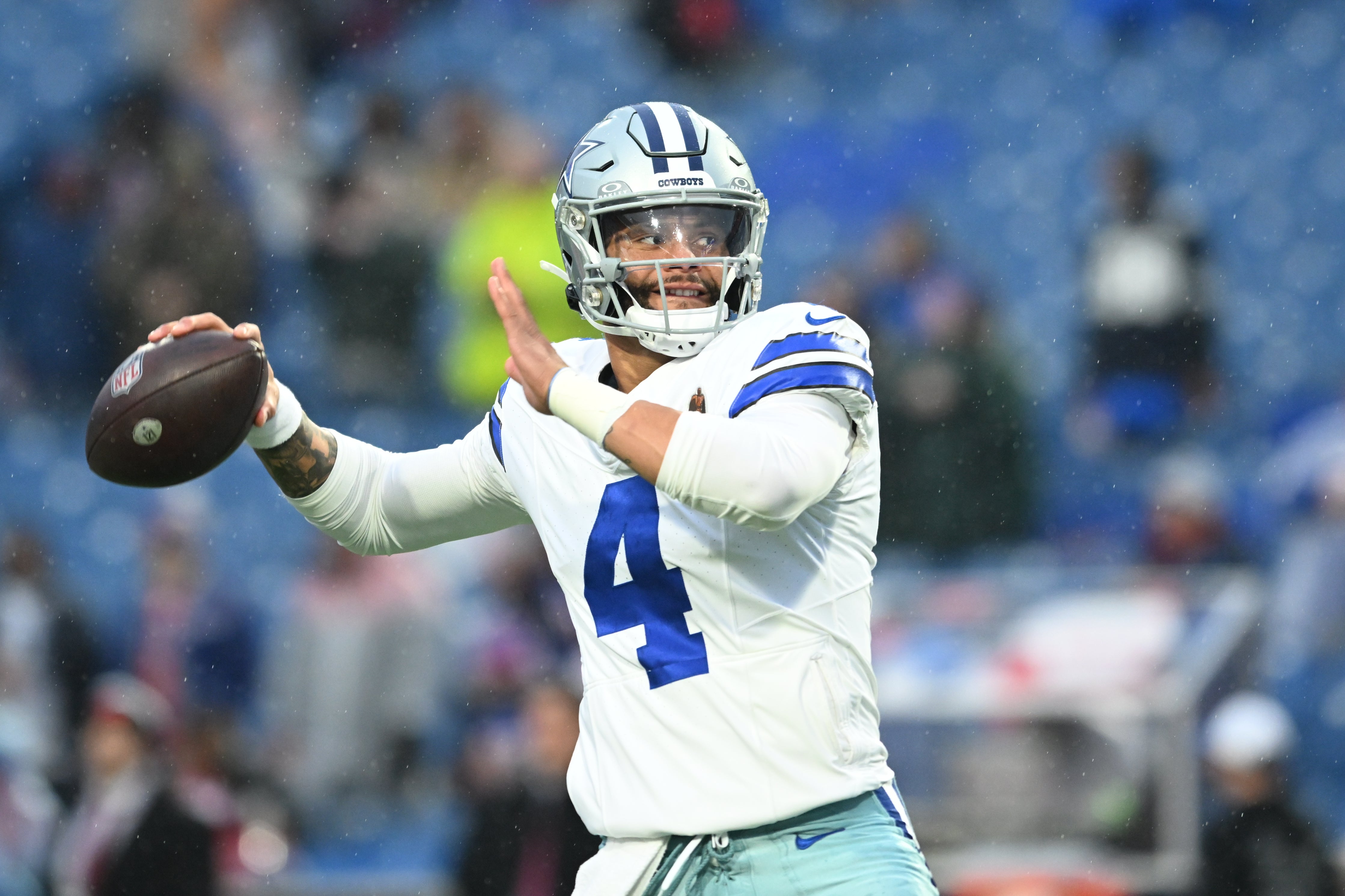 Dallas Cowboys quarterback Dak Prescott (4) warms up before the game against the Buffalo Bills at Highmark Stadium.