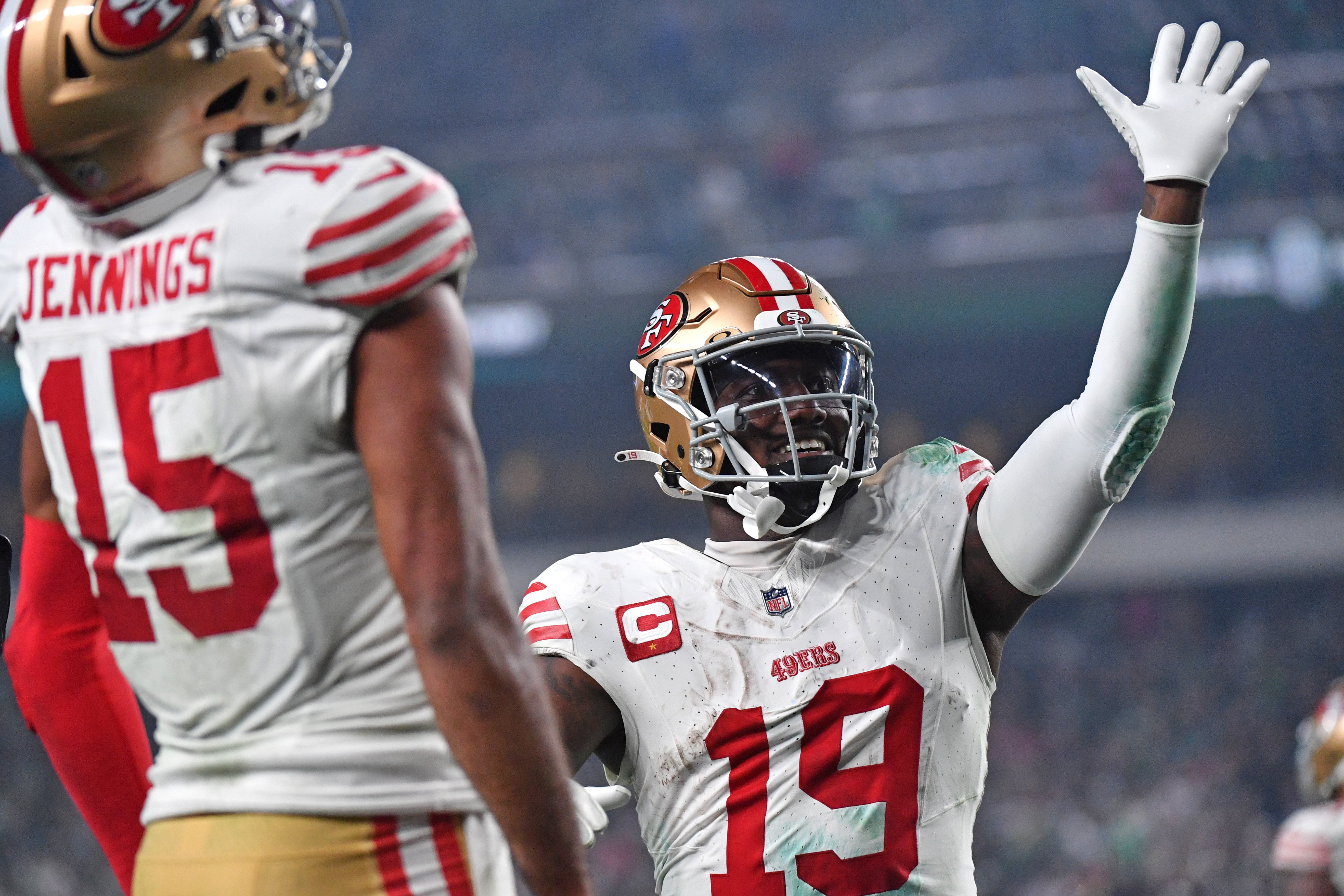 Dec 3, 2023; Philadelphia, Pennsylvania, USA; San Francisco 49ers wide receiver Deebo Samuel (19) waves goodbye to fans with wide receiver Jauan Jennings (15) against the Philadelphia Eagles during the fourth quarter at Lincoln Financial Field. Mandatory Credit: Eric Hartline-USA TODAY Sports