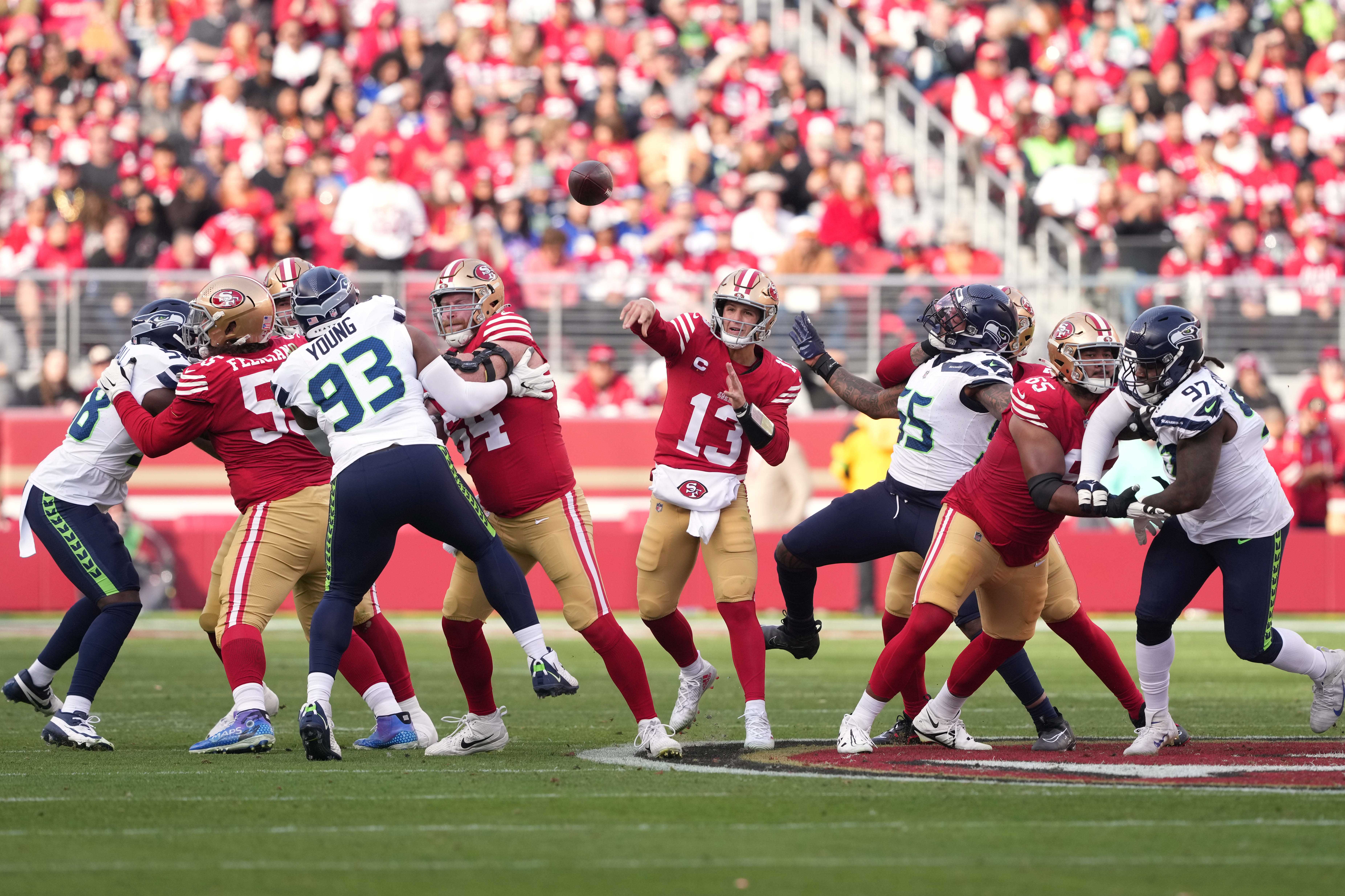 Dec 10, 2023; Santa Clara, California, USA; San Francisco 49ers quarterback Brock Purdy (13) passes as the offensive line blocks against the Seattle Seahawks during the second quarter at Levi's Stadium.