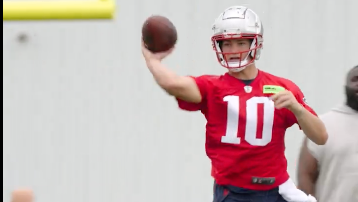 Drake Maye throws a no-look pass during OTAs on Wednesday, May 29, 2024