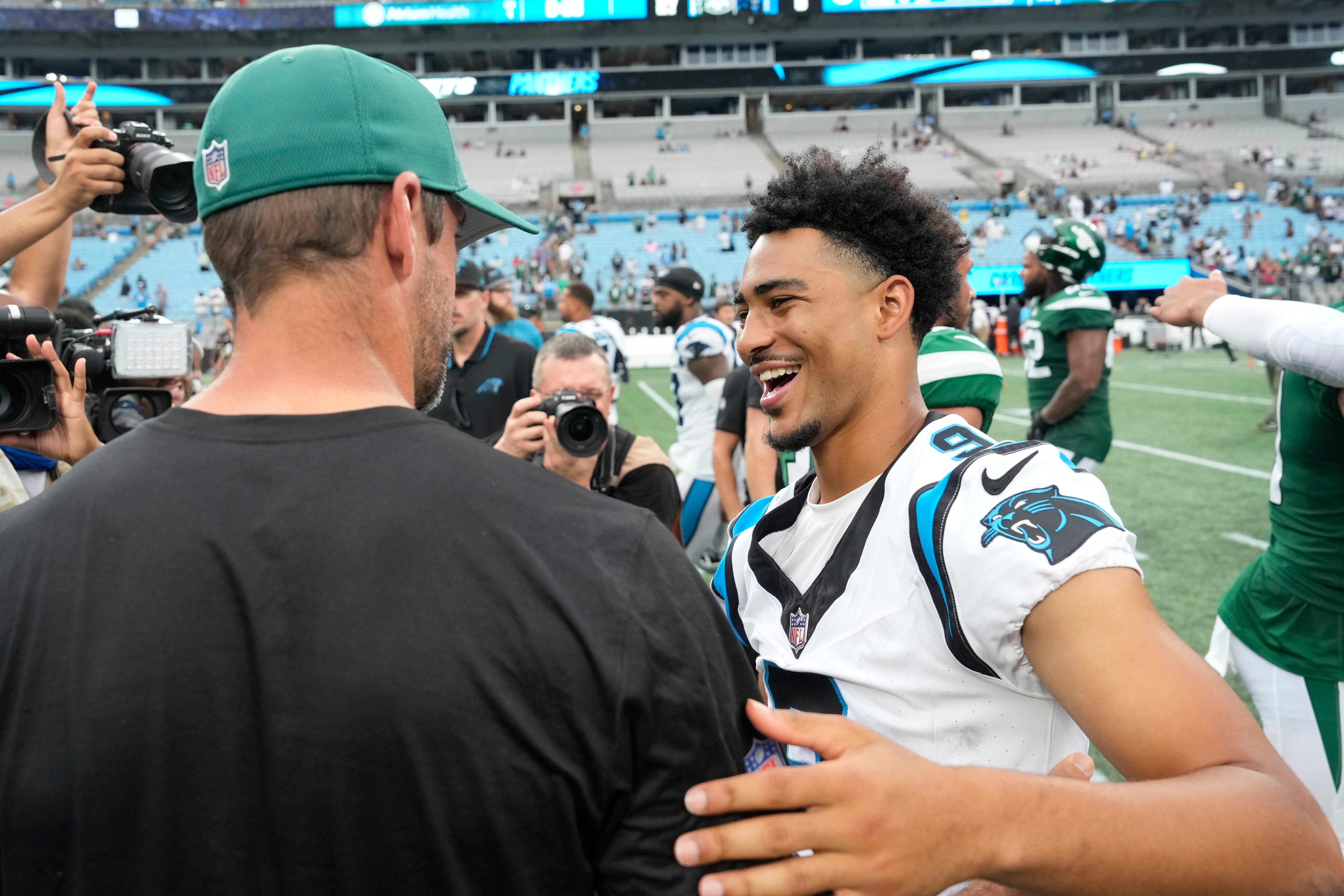 Aug 12, 2023; Charlotte, North Carolina, USA; Carolina Panthers quarterback Bryce Young (9) with New York Jets quarterback Aaron Rodgers (8) after the game at Bank of America Stadium. Mandatory Credit: Bob Donnan-USA TODAY Sports