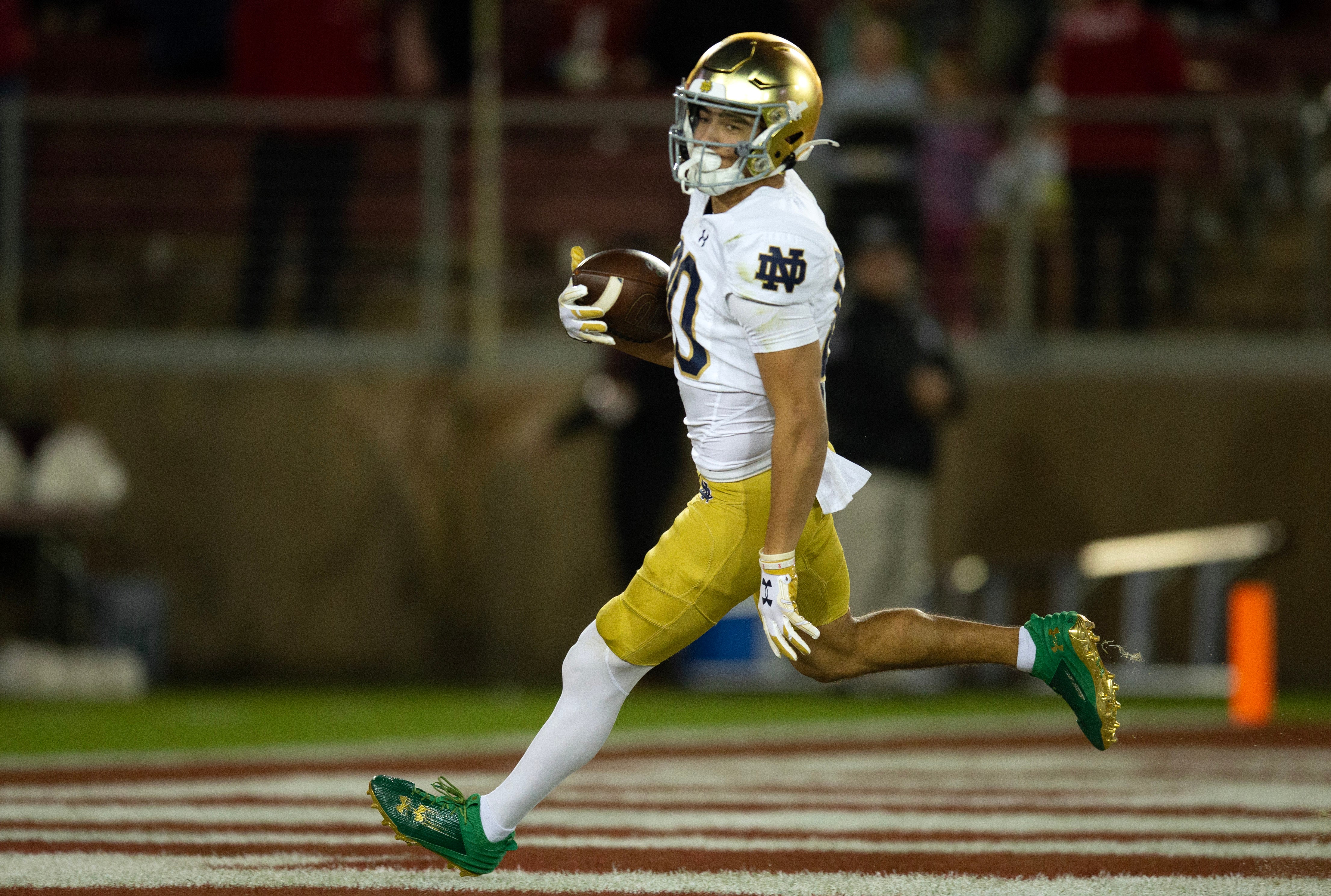Nov 25, 2023; Stanford, California, USA; Notre Dame Fighting Irish wide receiver Jordan Faison (80) runs in his touchdown reception against the Stanford Cardinal during the third quarter at Stanford Stadium.