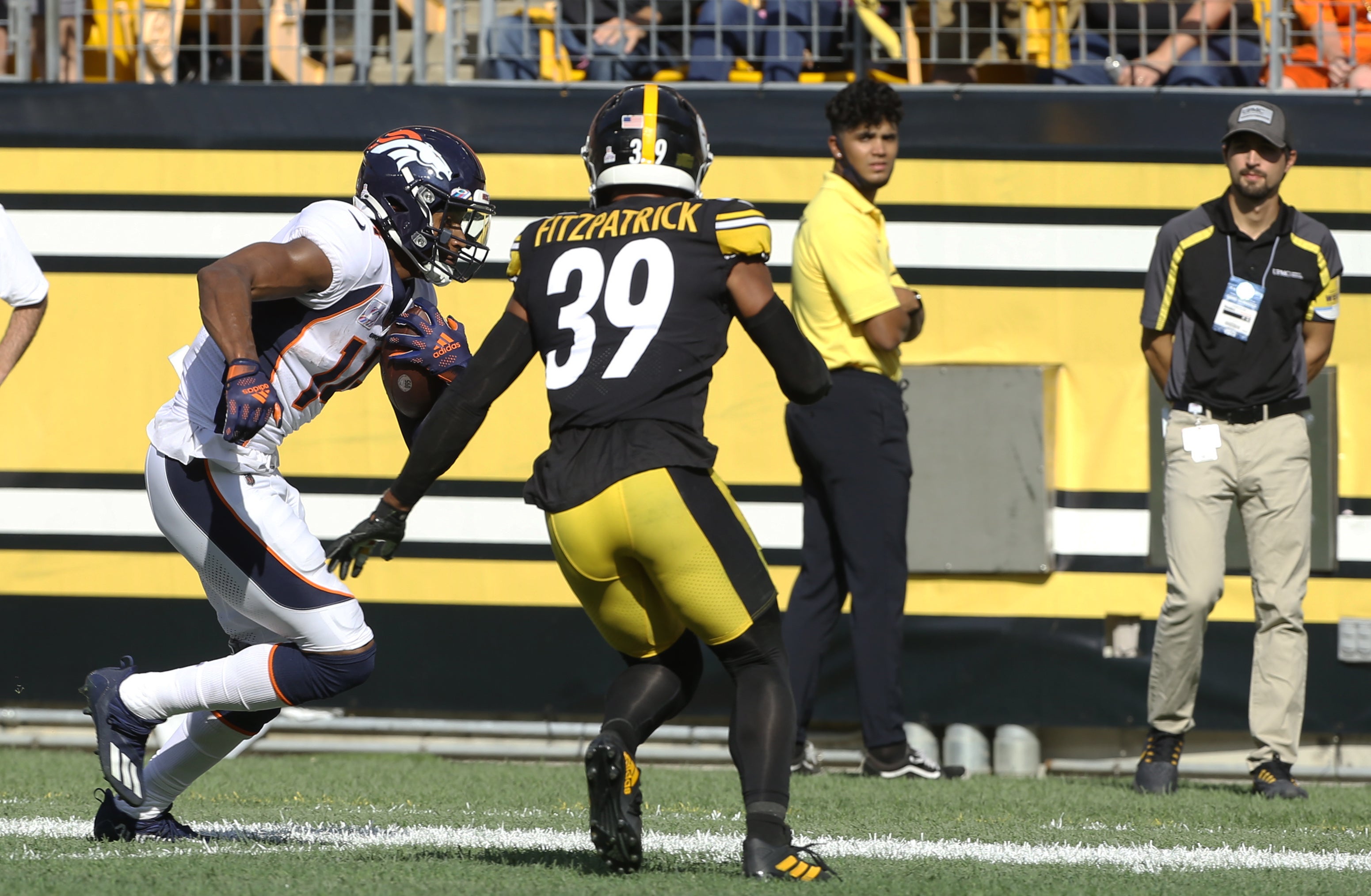 Oct 10, 2021; Pittsburgh, Pennsylvania, USA; Denver Broncos wide receiver Courtland Sutton (14) runs after a catch against Pittsburgh Steelers free safety Minkah Fitzpatrick (39) during the fourth quarter at Heinz Field. The Steelers won 27-19. Mandatory Credit: Charles LeClaire-USA TODAY Sports