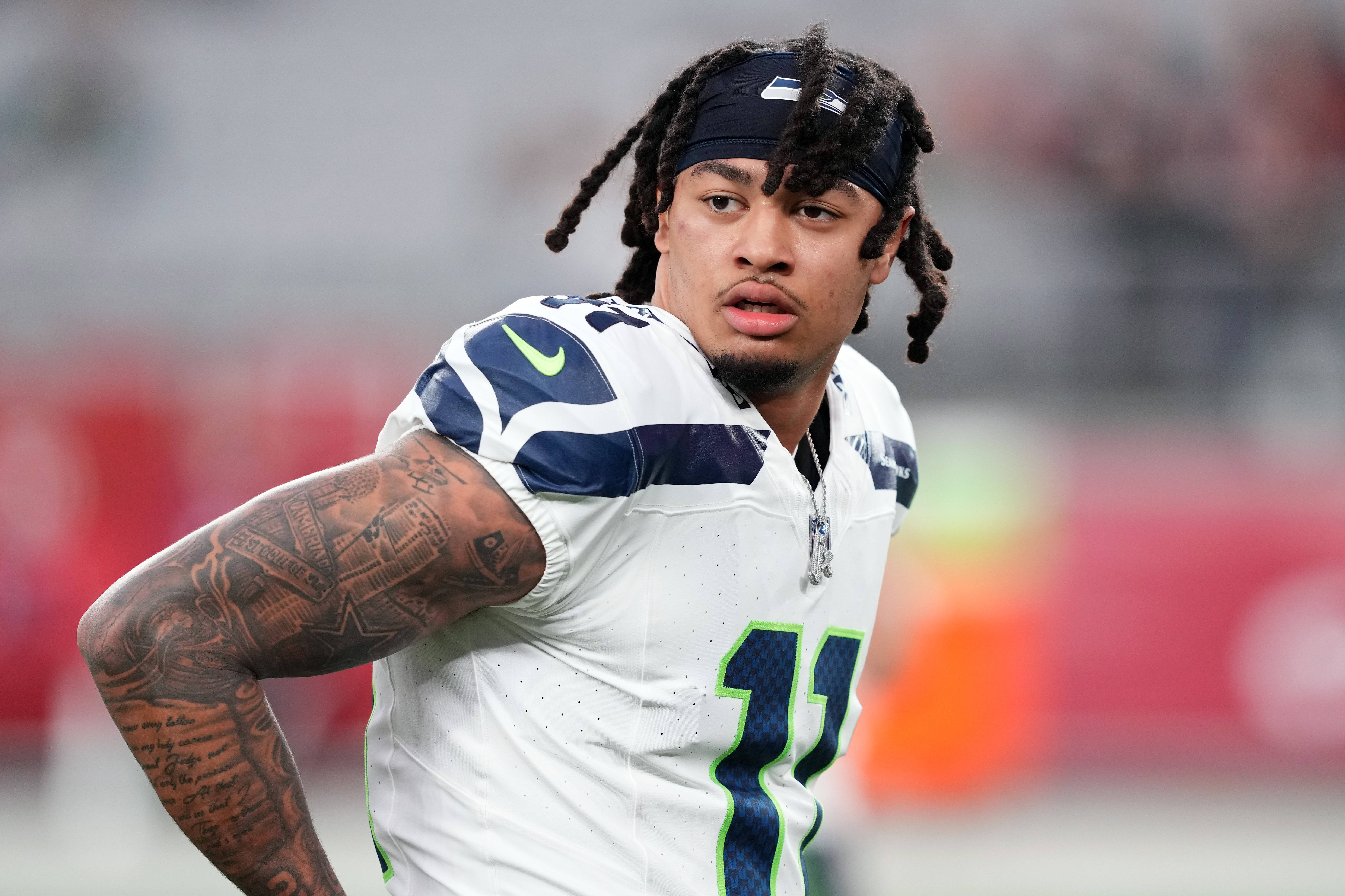 Jan 7, 2024; Glendale, Arizona, USA; Seattle Seahawks wide receiver Jaxon Smith-Njigba (11) warms up prior to facing the Arizona Cardinals at State Farm Stadium.