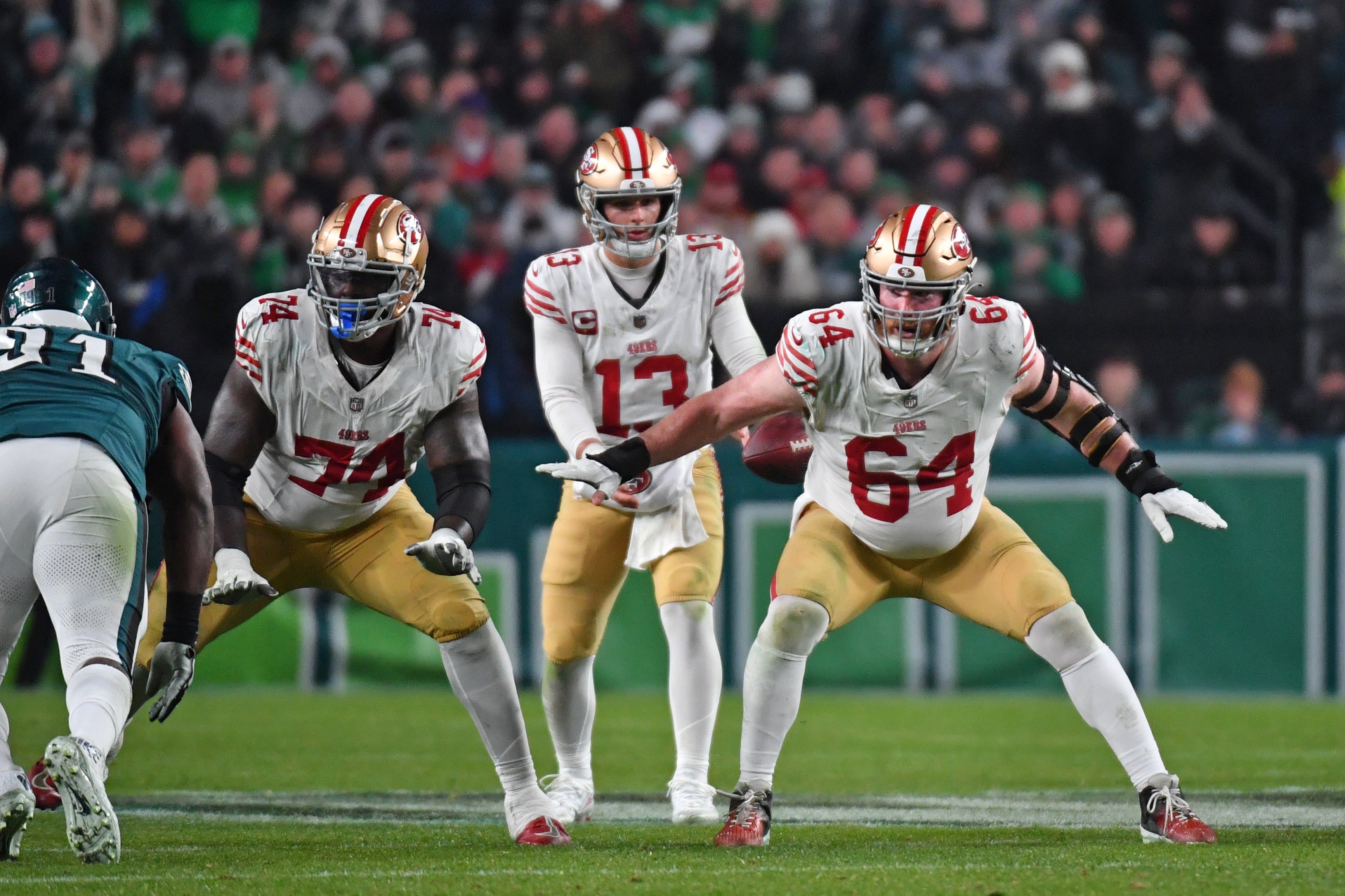 Dec 3, 2023; Philadelphia, Pennsylvania, USA; San Francisco 49ers offensive tackle Spencer Burford (74) and center Jake Brendel (64) block against the Philadelphia Eagles at Lincoln Financial Field.