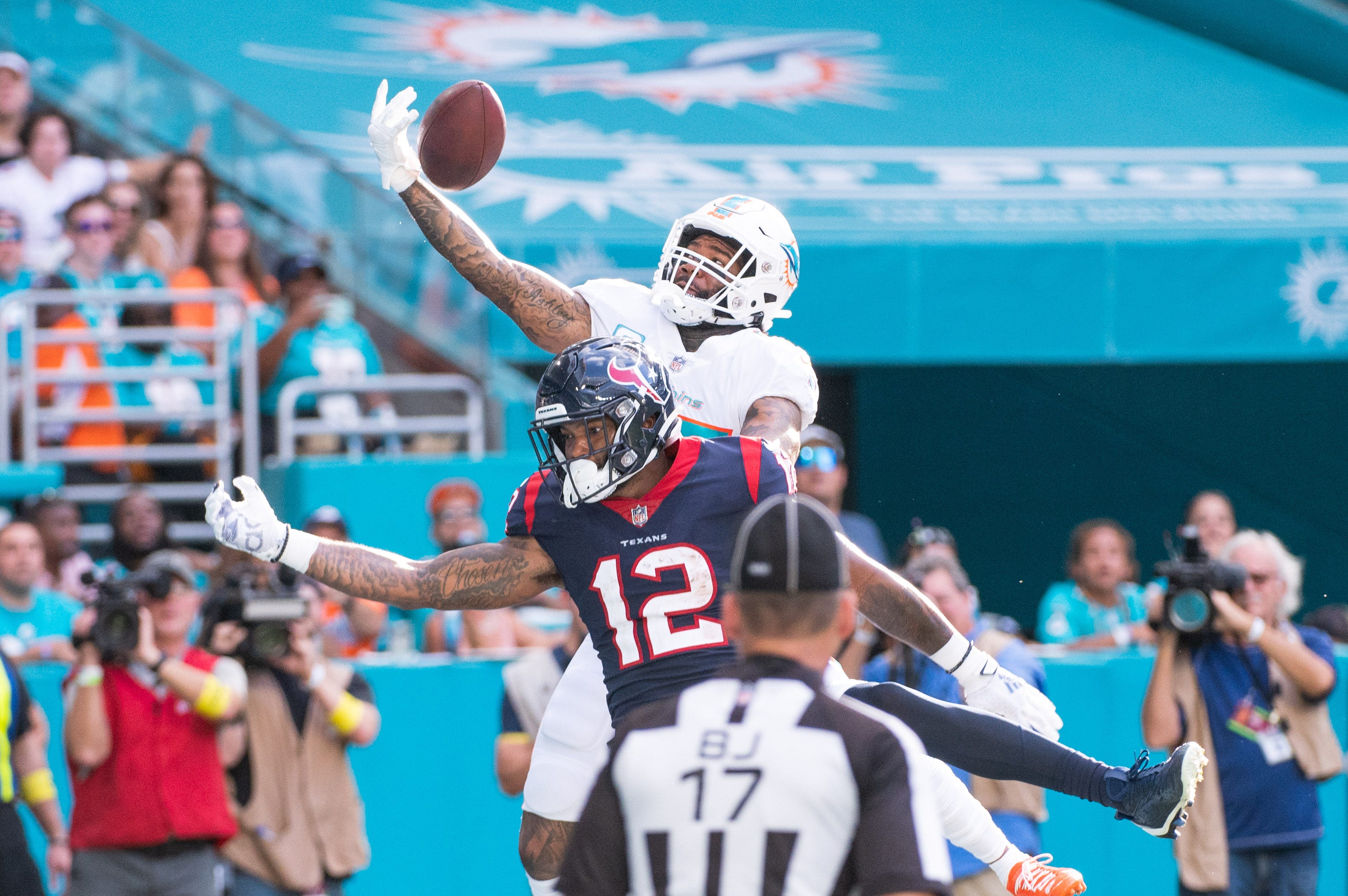 Miami Dolphins cornerback Xavien Howard (25) breaks up a pass intended for Houston Texans wide receiver Nico Collins (12) in the second half of the game between host Miami Dolphins and the Houston Texans at Hard Rock Stadium on Sunday, November 27, 2022, in Miami Gardens, FL.