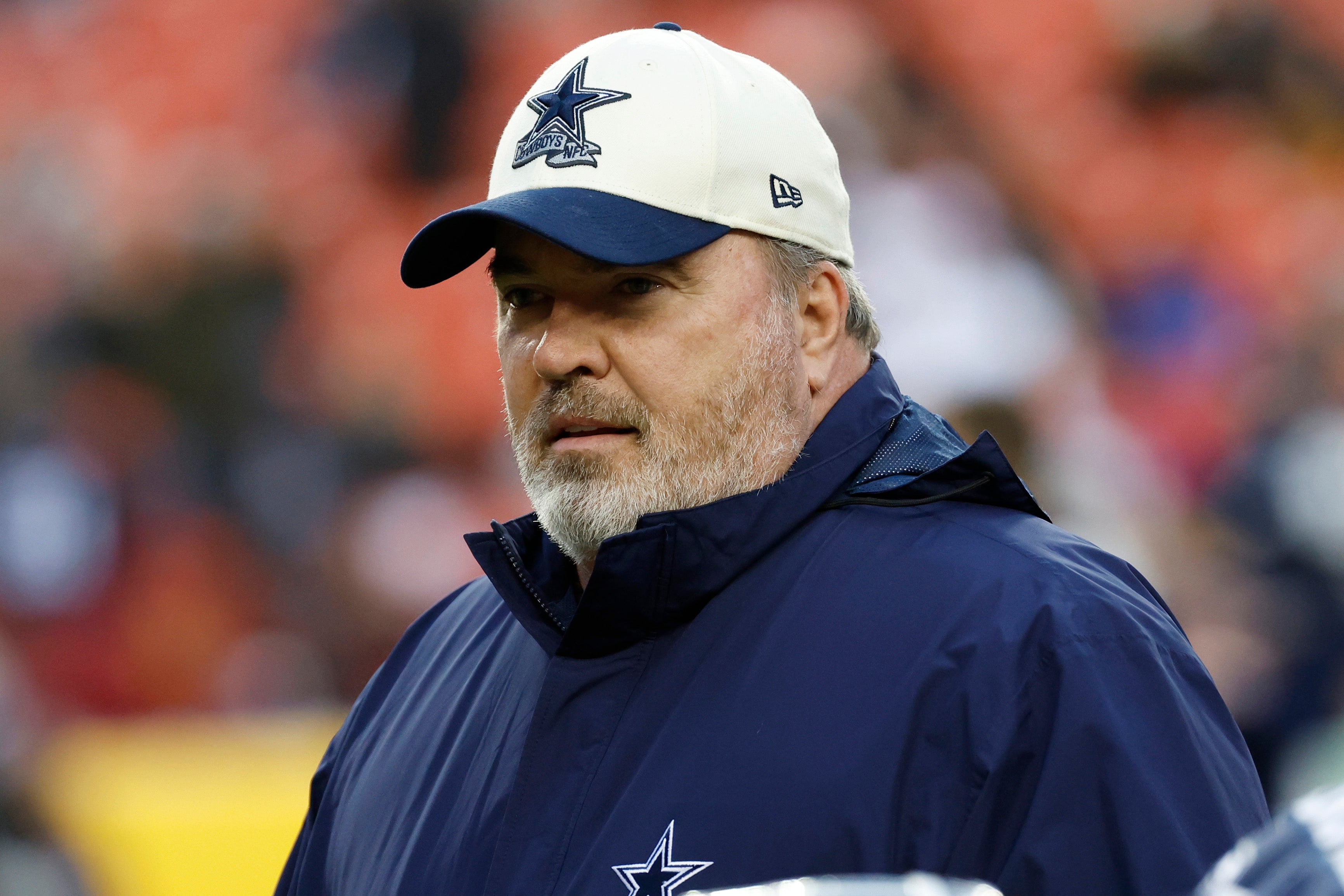 Dallas Cowboys head coach Mike McCarthy stands on the field during warmups prior to the Cowboys' game against the Washington Commanders at FedExField.