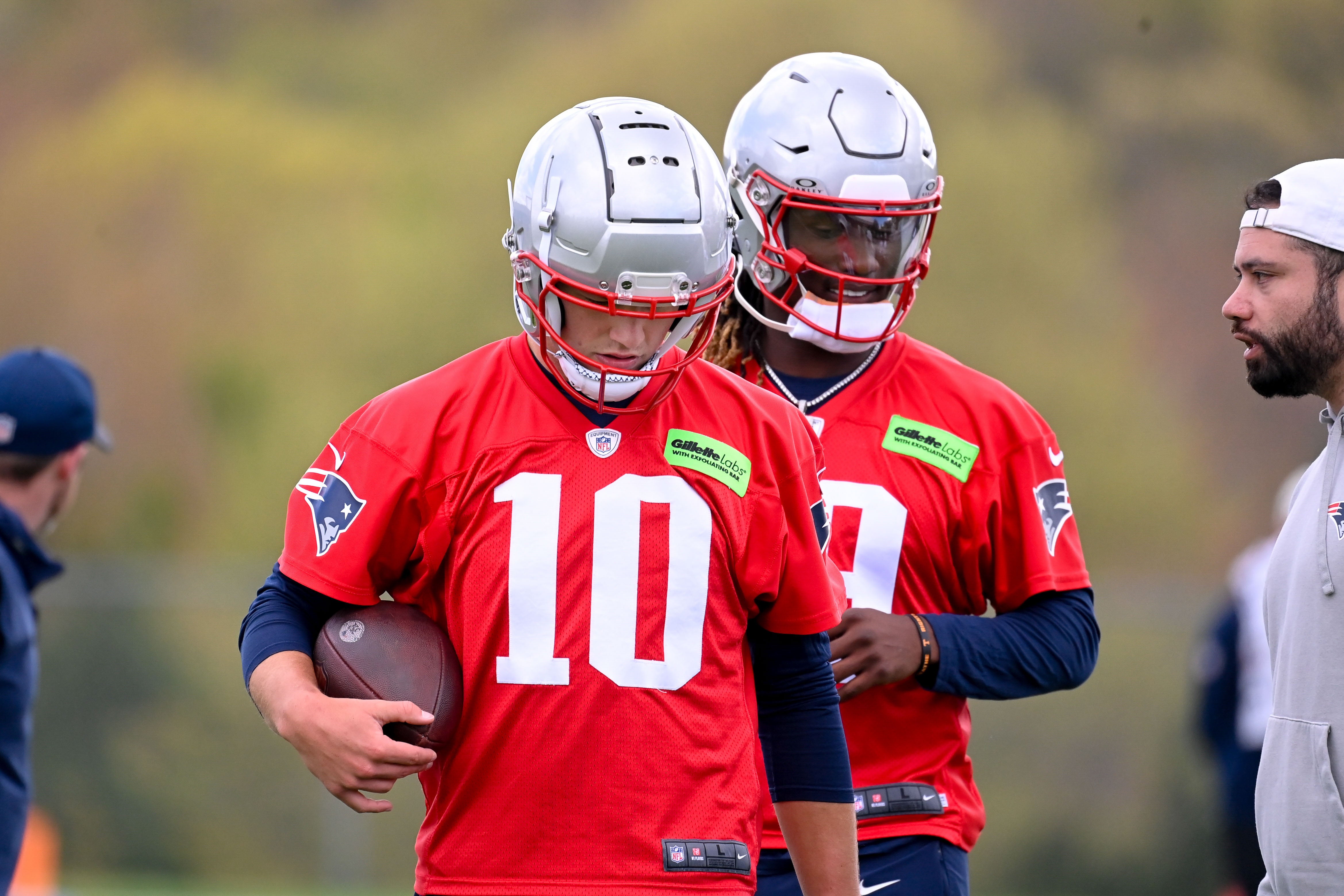 May 11, 2024; Foxborough, MA, USA; New England Patriots quarterback Drake Maye (10) (front) and New England Patriots quarterback Joe Milton III (19)(back) work out at the New England Patriots rookie camp at Gillette Stadium.
