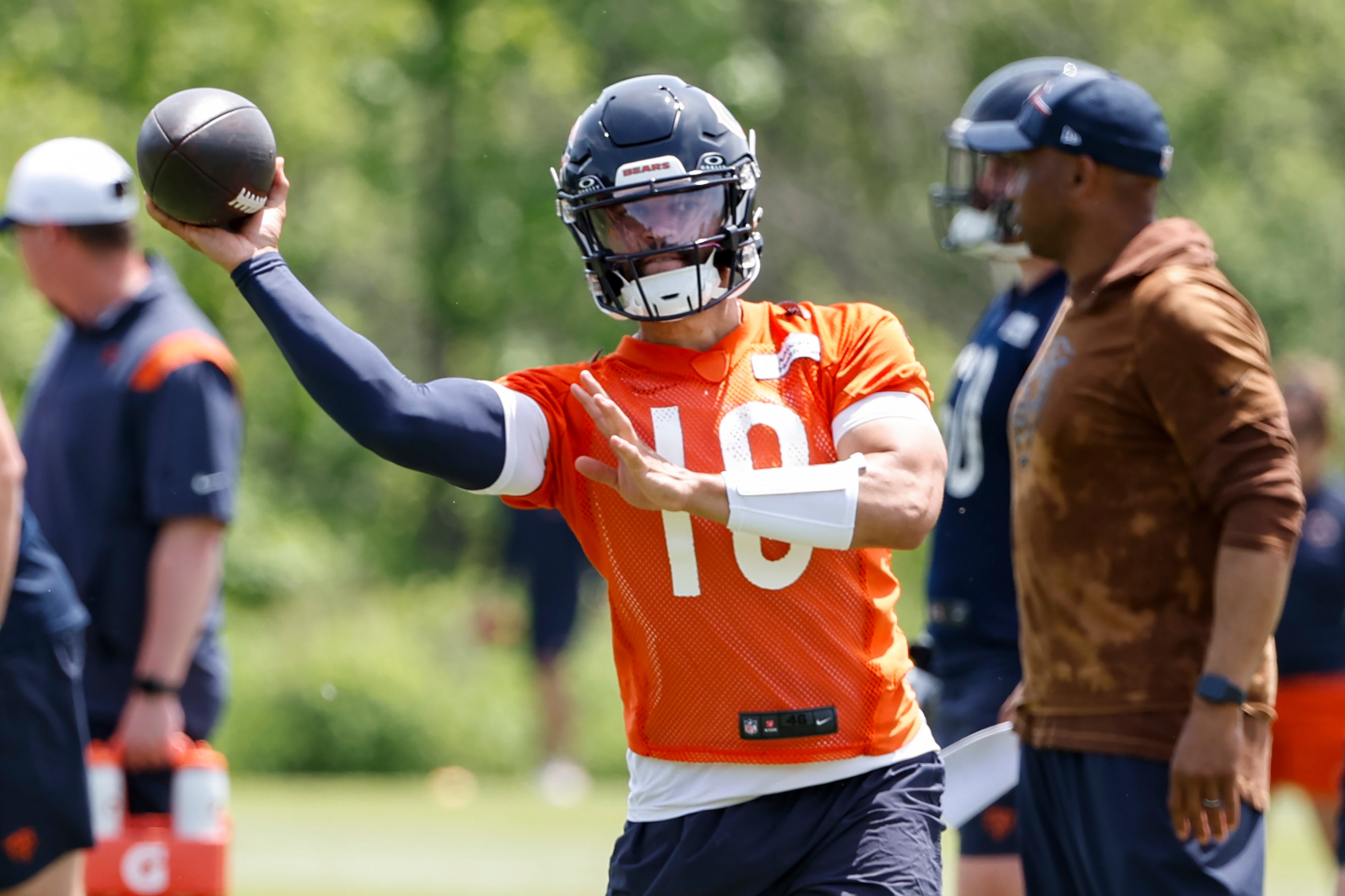 May 31, 2024; Lake Forest, IL, USA; Chicago Bears quarterback Caleb Williams (18) throws the ball during organized team activities at Halas Hall.