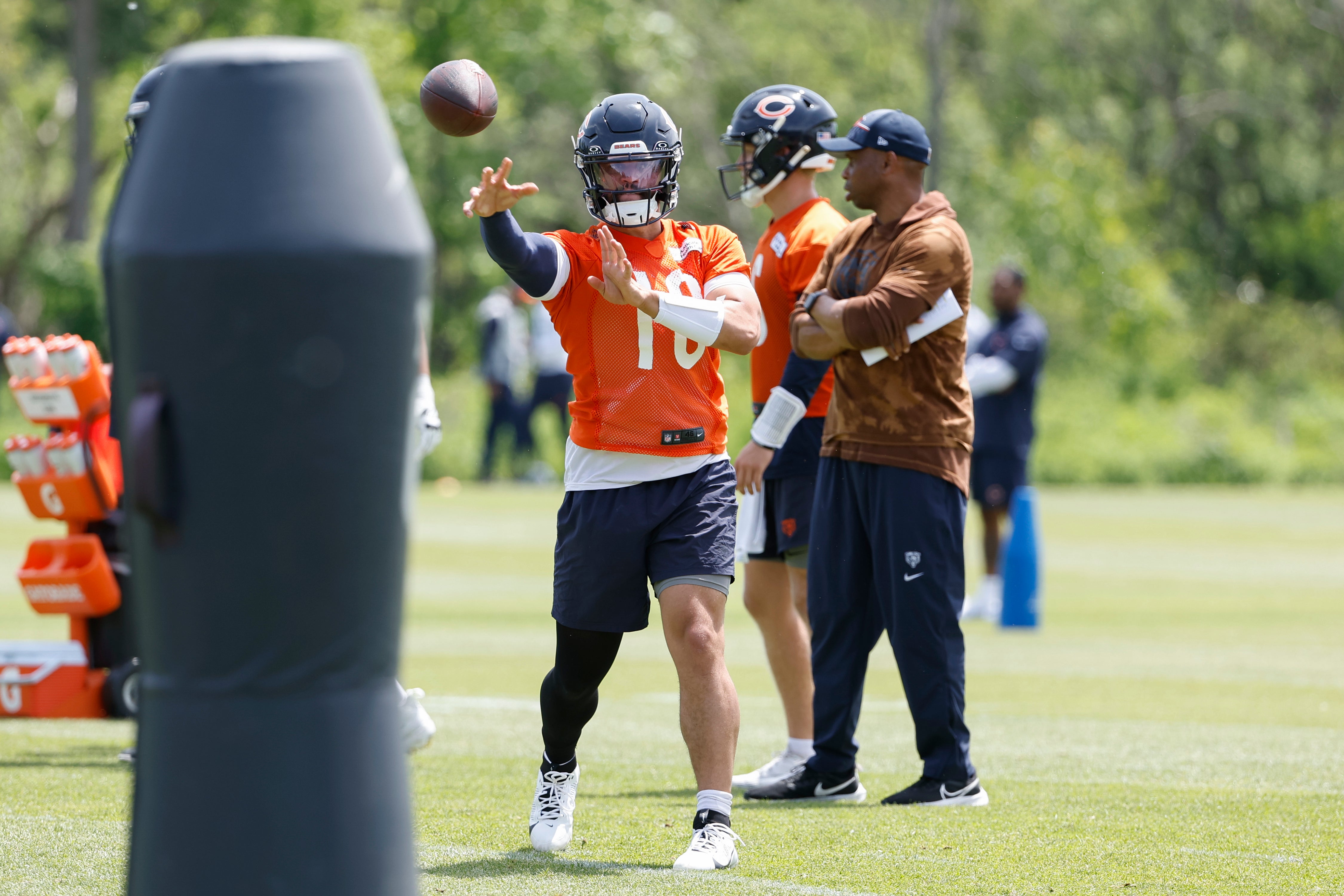 May 31, 2024; Lake Forest, IL, USA; Chicago Bears quarterback Caleb Williams (18) throws the ball during organized team activities at Halas Hall.