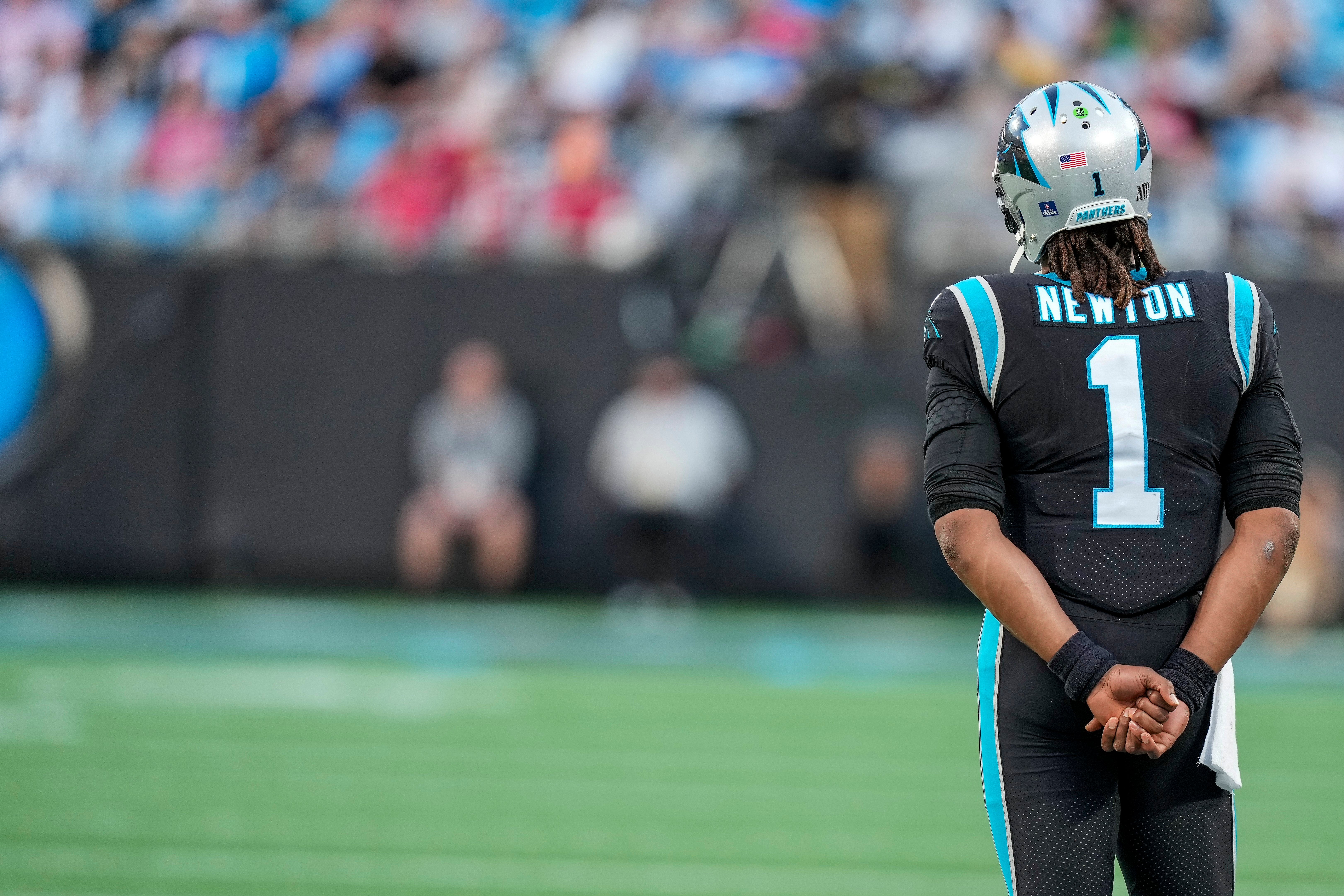 Dec 26, 2021; Charlotte, North Carolina, USA; Carolina Panthers quarterback Cam Newton (1) looks on during the second half against the Tampa Bay Buccaneers at Bank of America Stadium. Mandatory Credit: Jim Dedmon-USA TODAY Sports