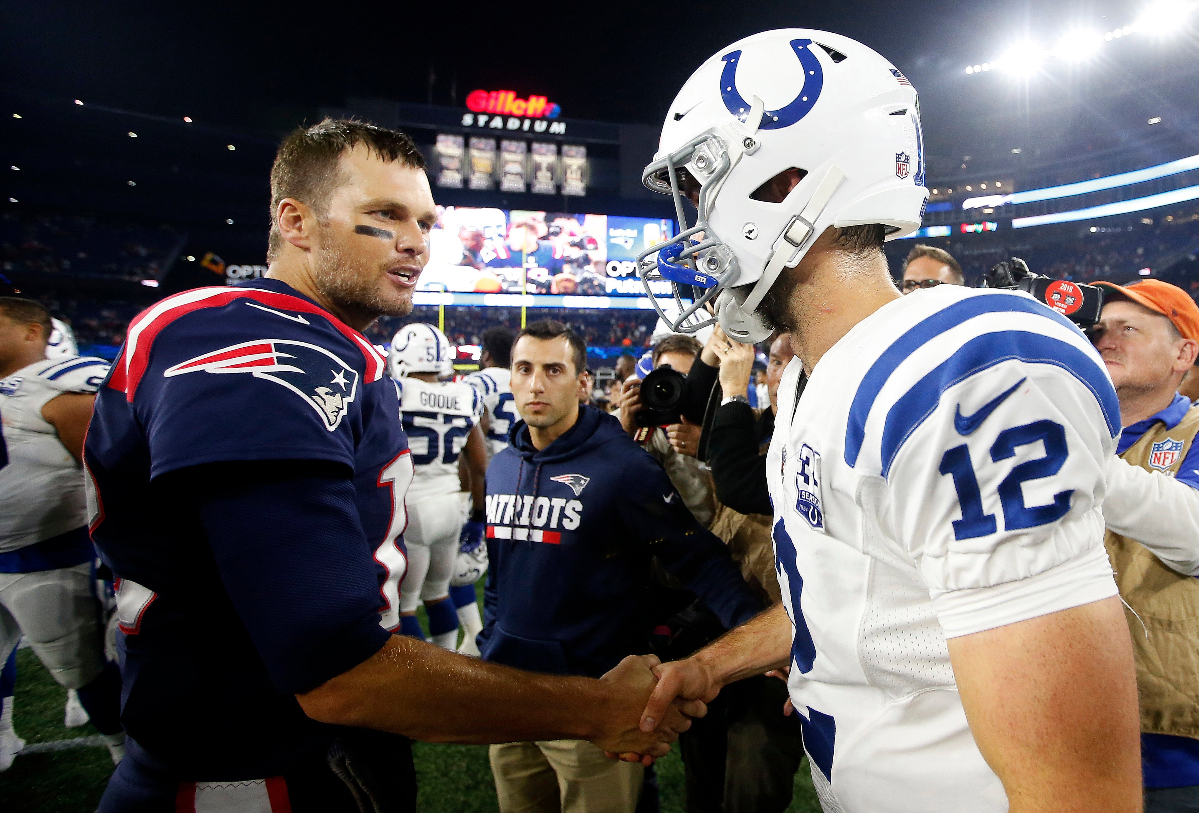 Oct 4, 2018; Foxborough, MA, USA; New England Patriots quarterback Tom Brady (12) shakes hands with Indianapolis Colts quarterback Andrew Luck (12) after New England's 38-24 win at Gillette Stadium.