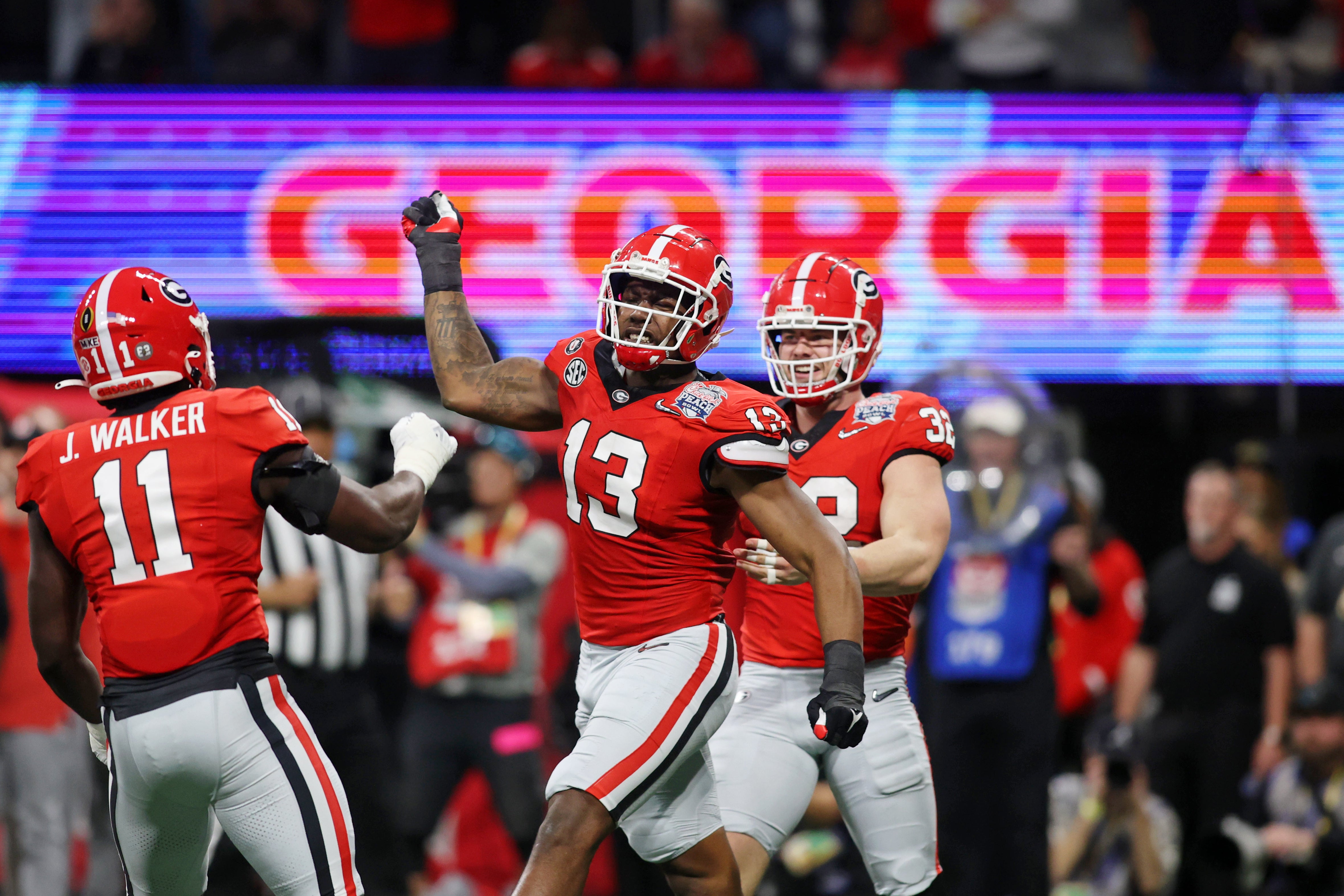 Dec 31, 2022; Atlanta, Georgia, USA; Georgia Bulldogs defensive lineman Mykel Williams (13) reacts after a play against the Ohio State Buckeyes during the first half of the 2022 Peach Bowl at Mercedes-Benz Stadium.