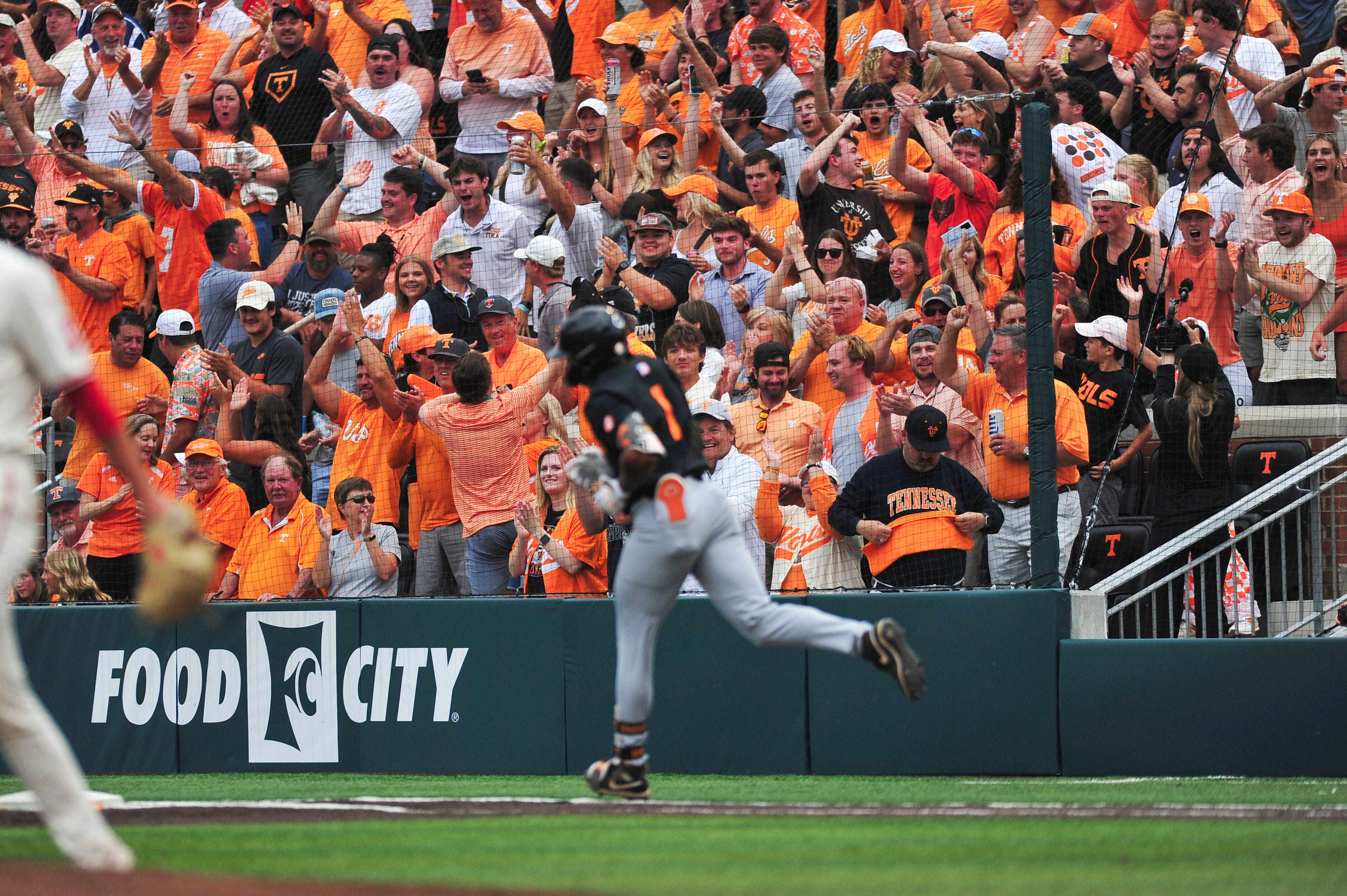 Tennessee baseball fans celebrate after Tennessee's Christian Moore (1) hits a home run during a NCAA Baseball Tournament Knoxville Regional game at Lindsey Nelson Stadium on Saturday, June 1, 2024 in Knoxville, Tenn.