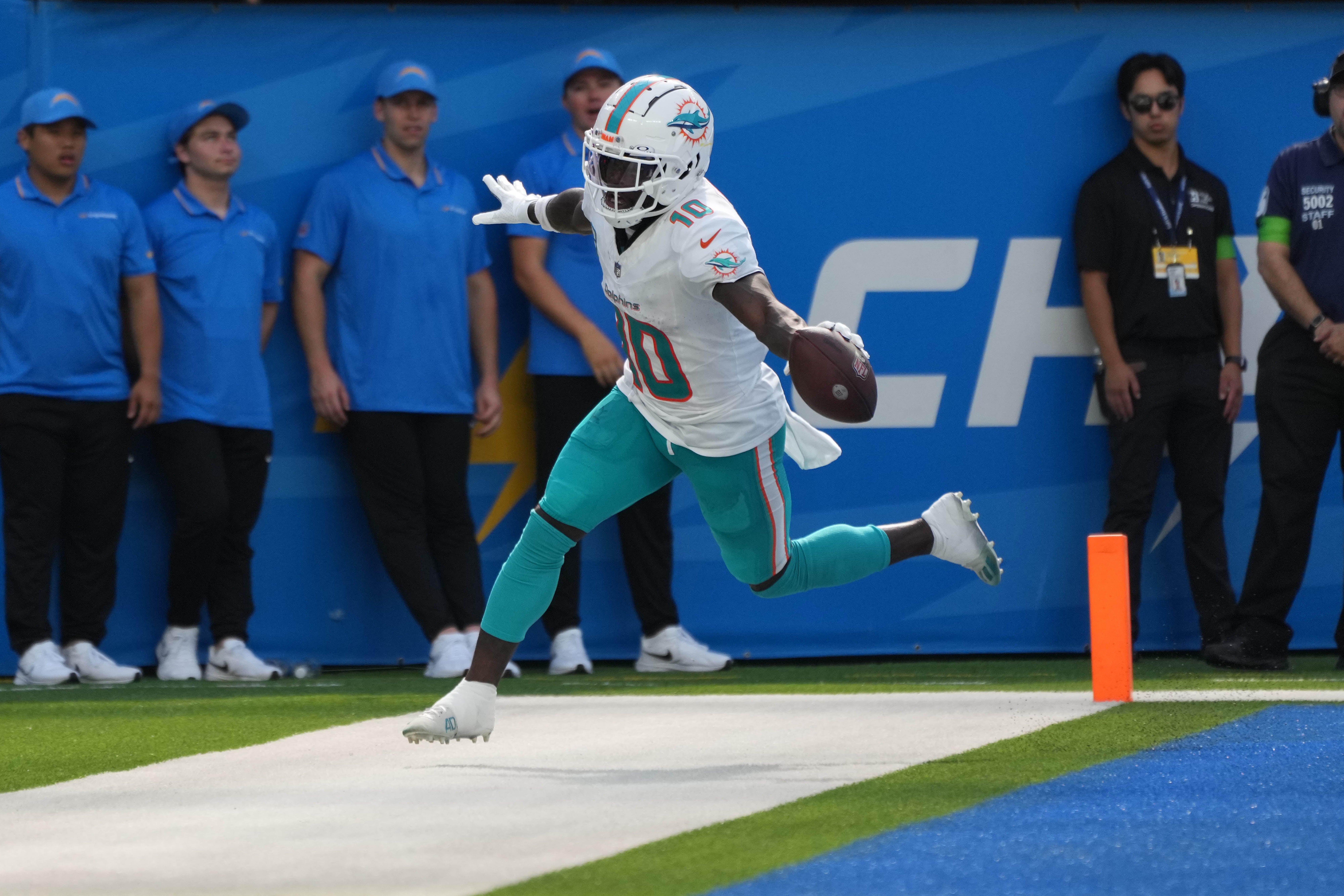 Sep 10, 2023; Inglewood, California, USA; Miami Dolphins wide receiver Tyreek Hill (10) celebrates after catching a 35-yard touchdown pass in the third quarter against the Miami Dolphins at SoFi Stadium.