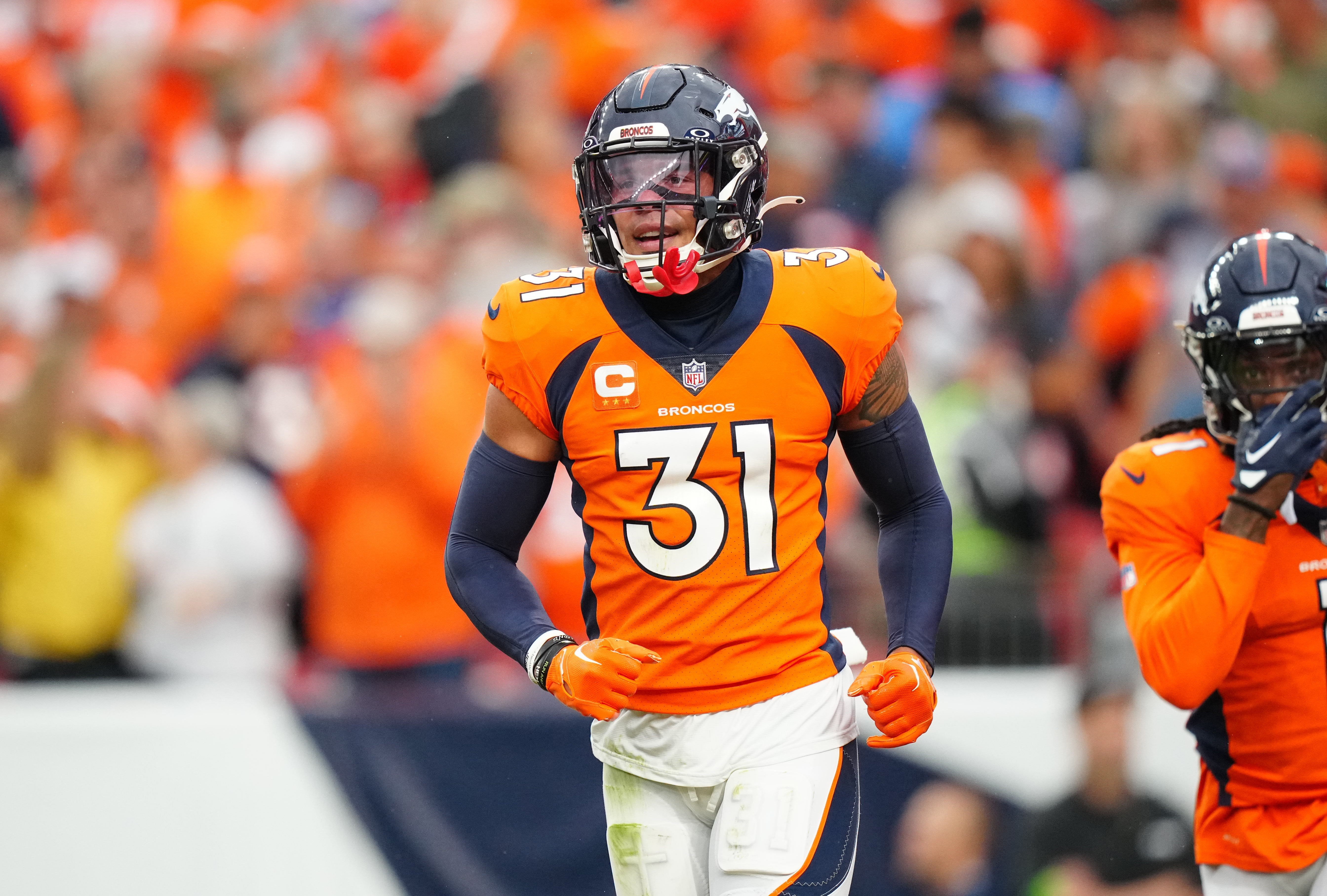 Sep 10, 2023; Denver, Colorado, USA; Denver Broncos safety Justin Simmons (31) reacts to a turnover in the third quarter against the Las Vegas Raiders at Empower Field at Mile High.