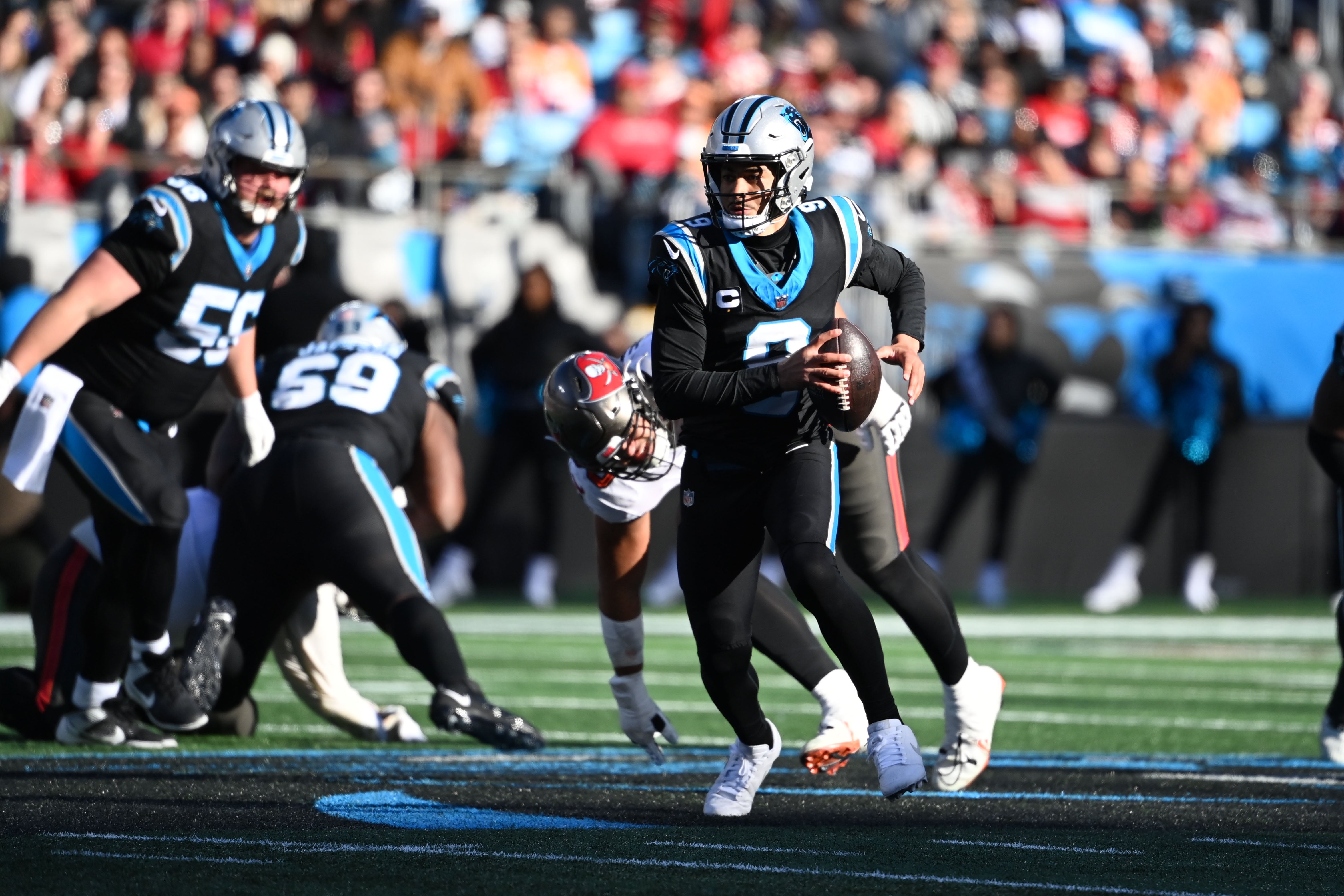 Jan 7, 2024; Charlotte, North Carolina, USA; Carolina Panthers quarterback Bryce Young (9) scrambles in the third quarter at Bank of America Stadium. Mandatory Credit: Bob Donnan-USA TODAY Sports