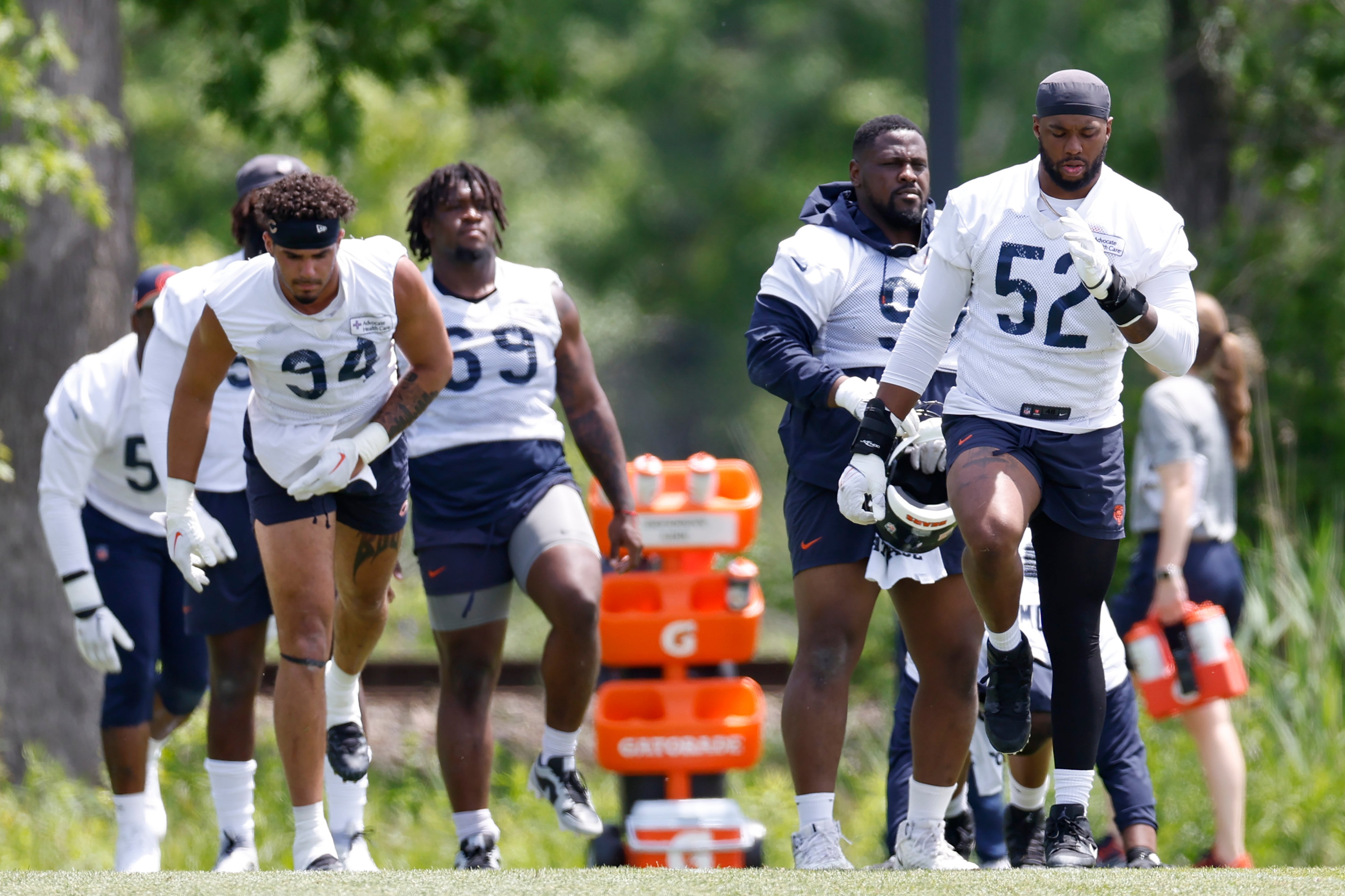 May 31, 2024; Lake Forest, IL, USA; Chicago Bears players warm up during organized team activities at Halas Hall.