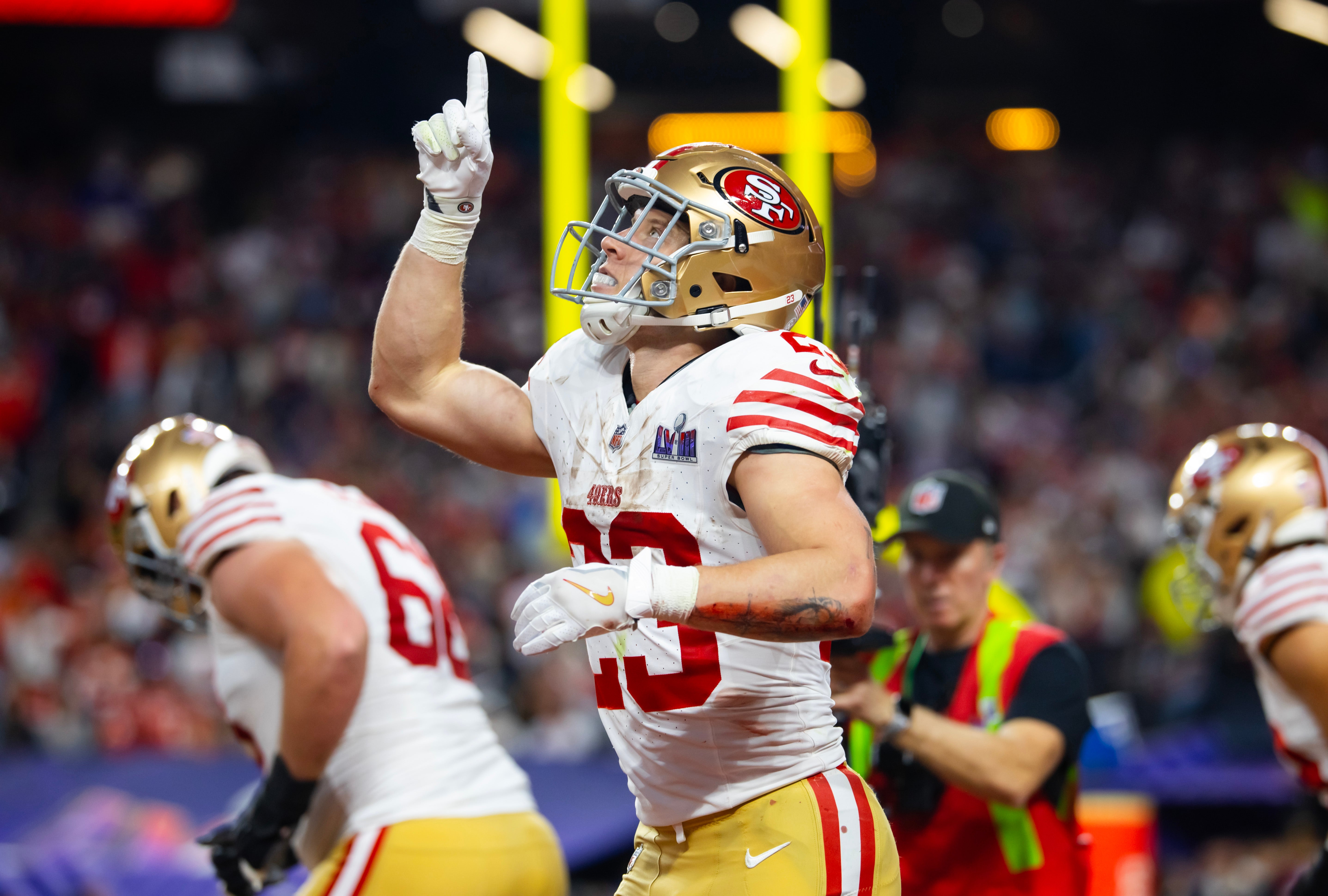 Feb 11, 2024; Paradise, Nevada, USA; San Francisco 49ers running back Christian McCaffrey (23) celebrates after scoring a touchdown in the first half of Super Bowl LVIII at Allegiant Stadium.