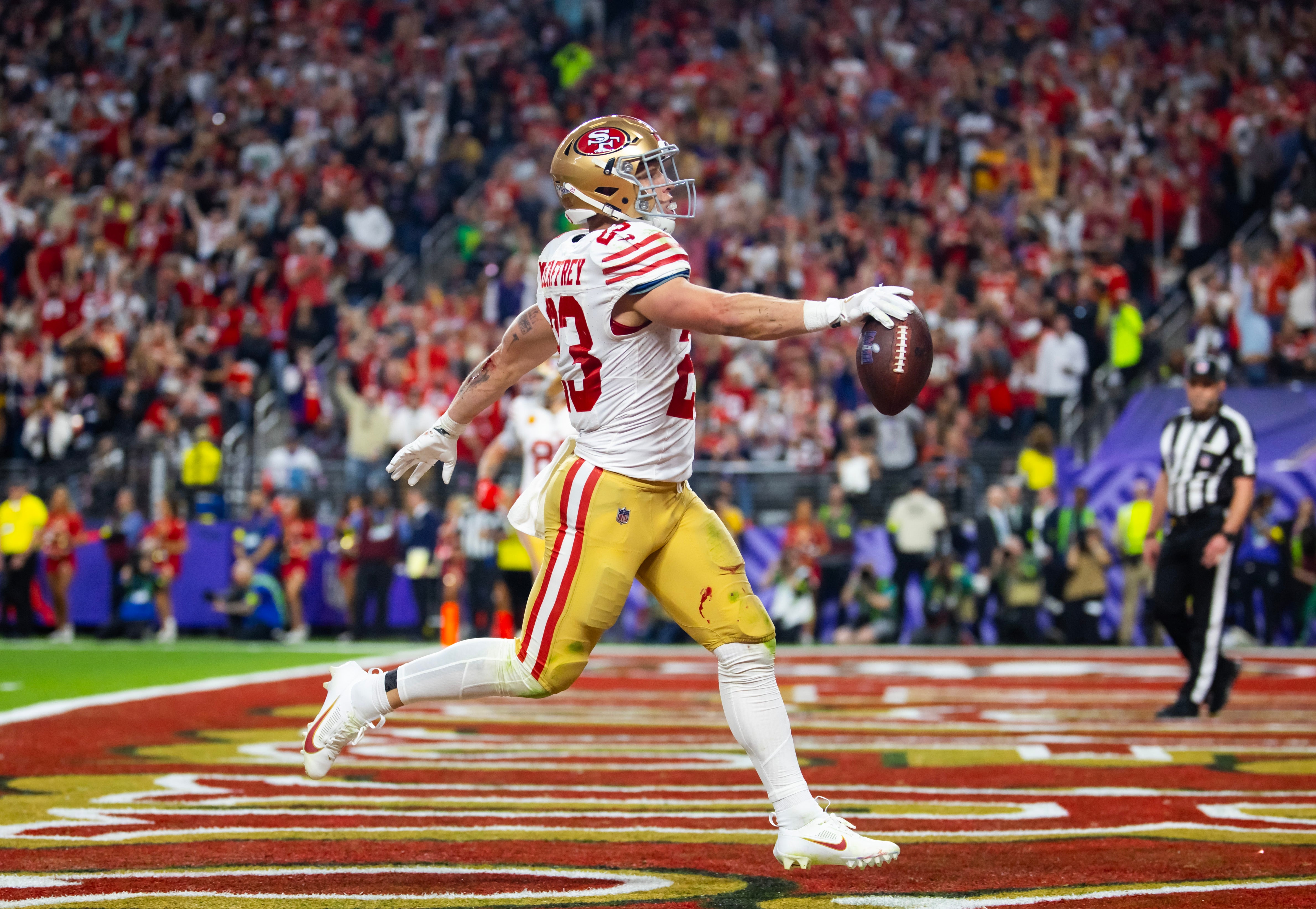 Feb 11, 2024; Paradise, Nevada, USA; San Francisco 49ers running back Christian McCaffrey (23) celebrates after scoring a touchdown in the first half of Super Bowl LVIII at Allegiant Stadium.