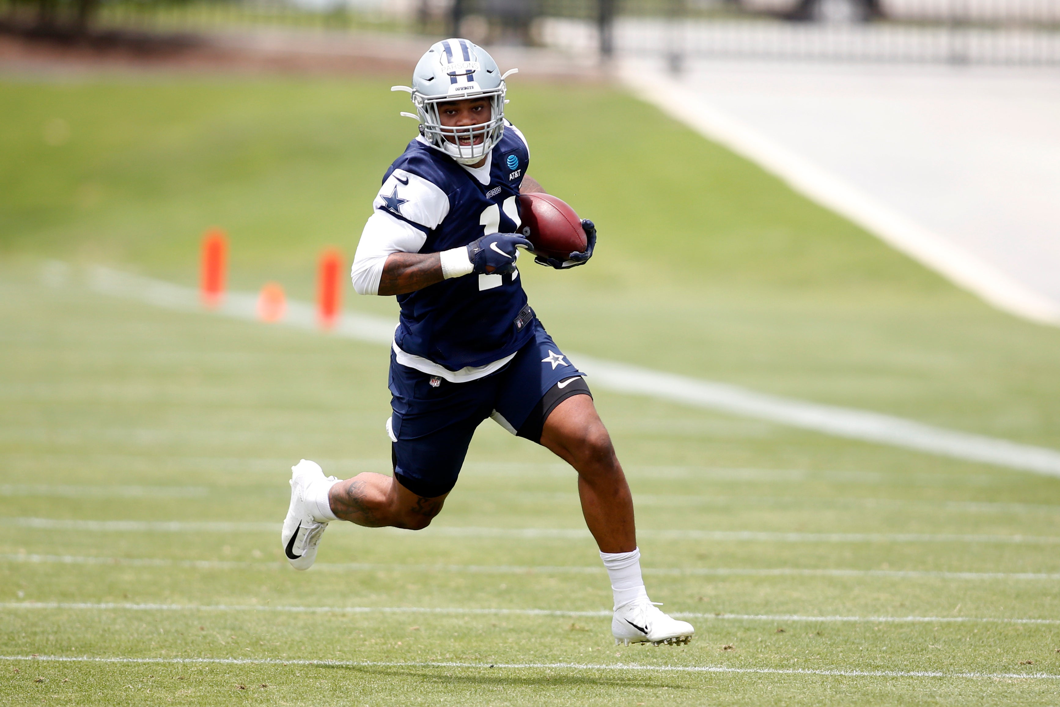 Dallas Cowboys linebacker Micah Parsons (11) goes through drills during voluntary Organized Team Activities at the Star Training Facility in Frisco, Texas.