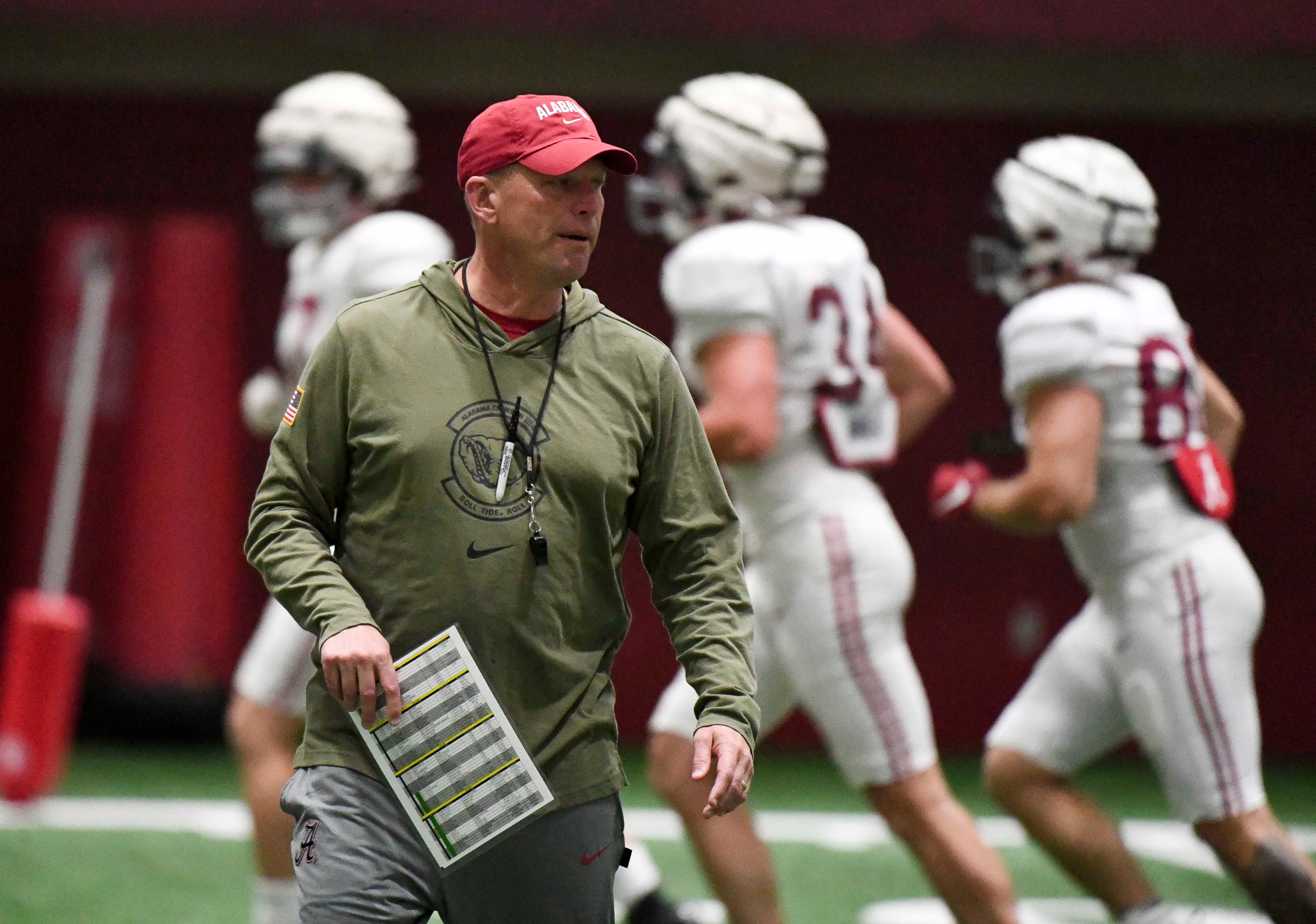 April 9, 2024; Tuscaloosa, Alabama, USA; Alabama head coach Kalen DeBoer coaches his team during practice in the Hank Crisp Indoor Practice Facility at the University of Alabama