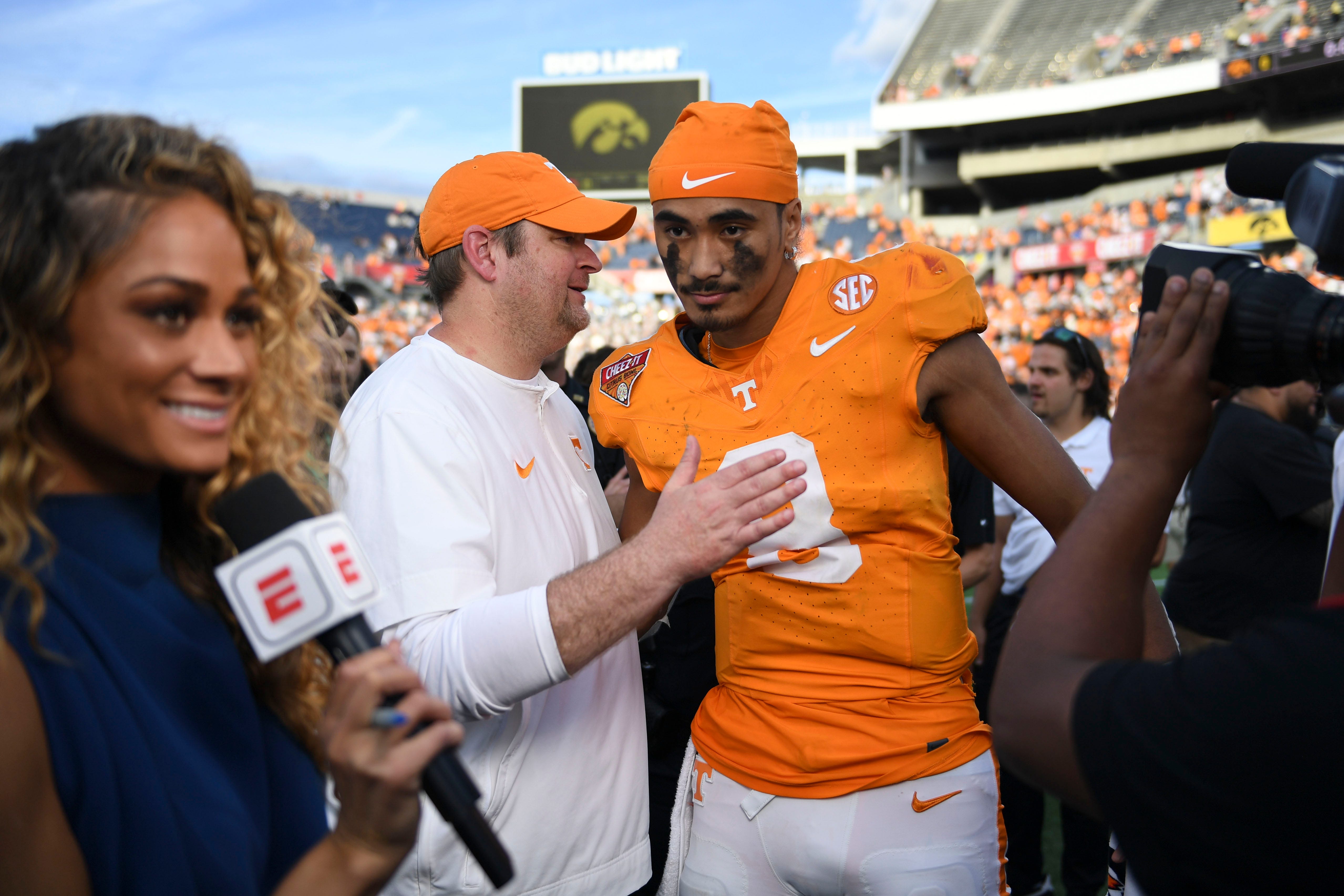 Tennessee head coach Josh Heupel turns to quarterback Nico Iamaleava (8) after their post game interview after winning the Citrus Bowl NCAA College football game on Monday, January 1, 2024 in Orlando, Fla. against Iowa.