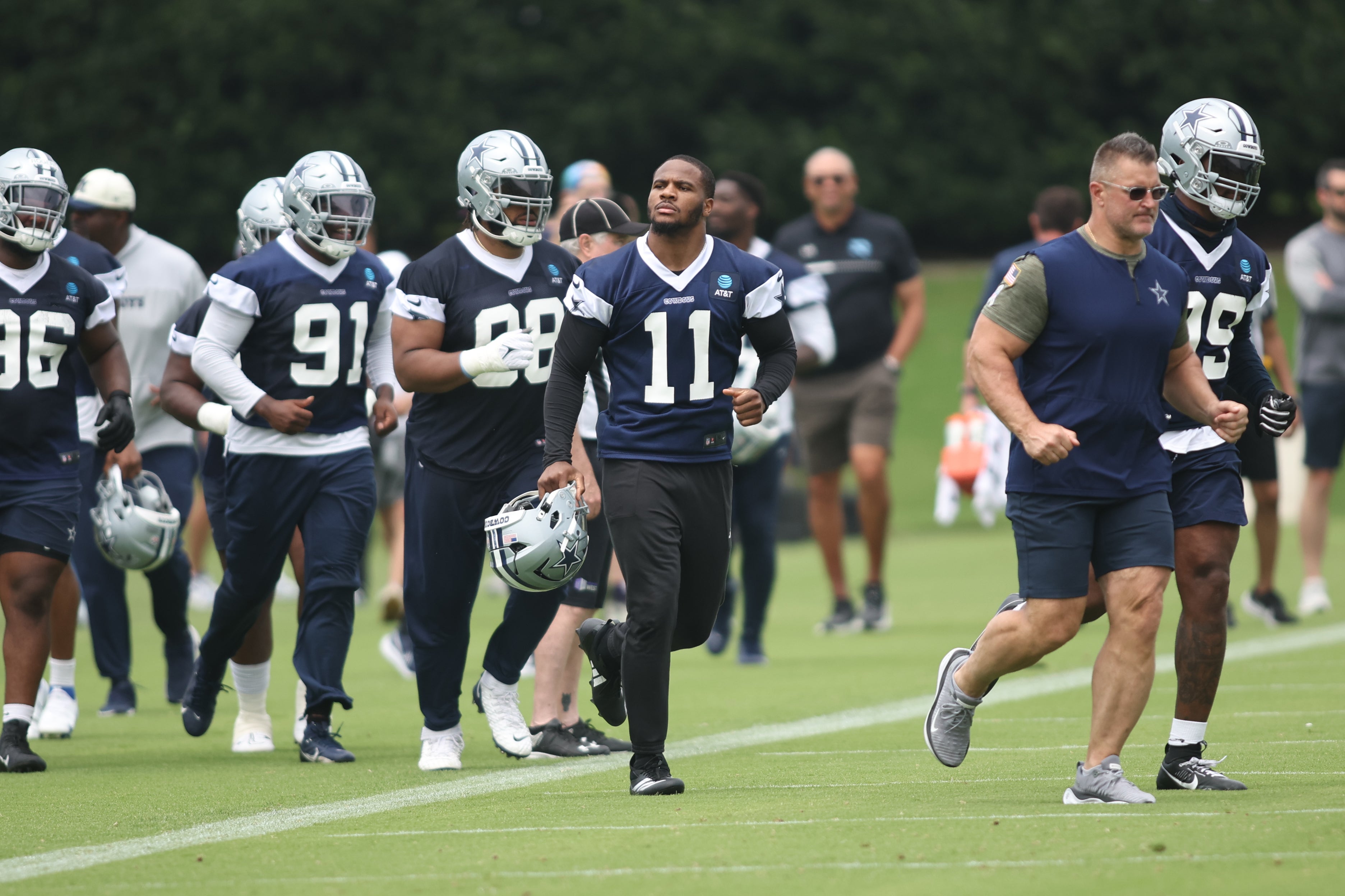 Dallas Cowboys linebacker Micah Parsons (11) runs on the field during practice at the Ford Center at the Star Training Facility in Frisco, Texas.