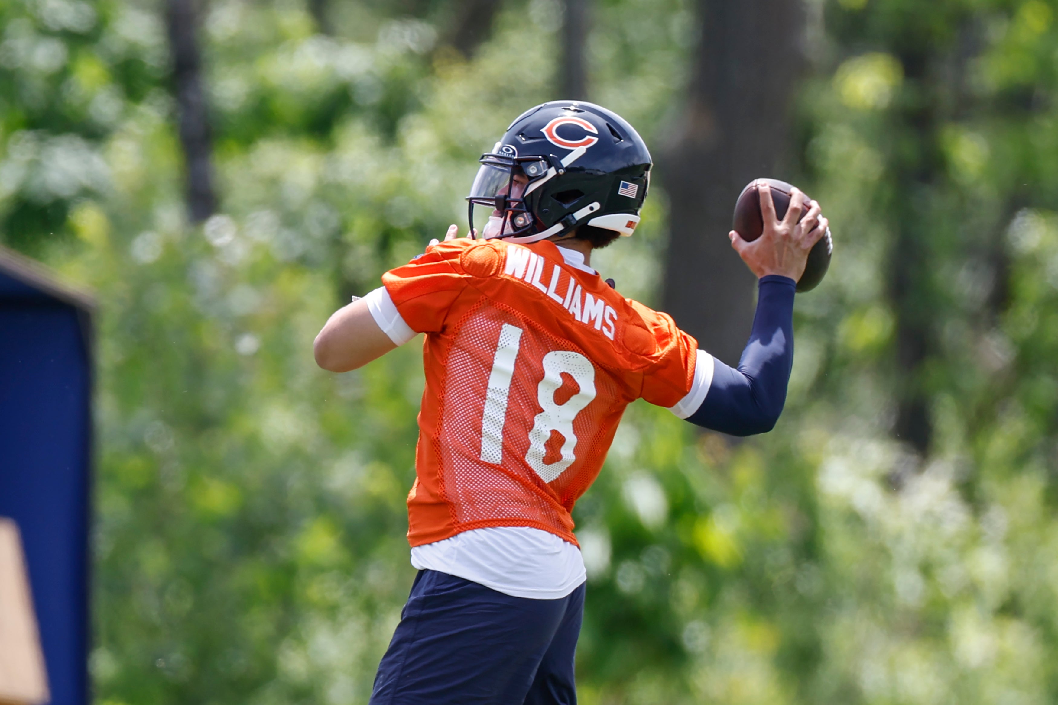 Caleb Williams (18) throws the ball during organized team activities at Halas Hall.