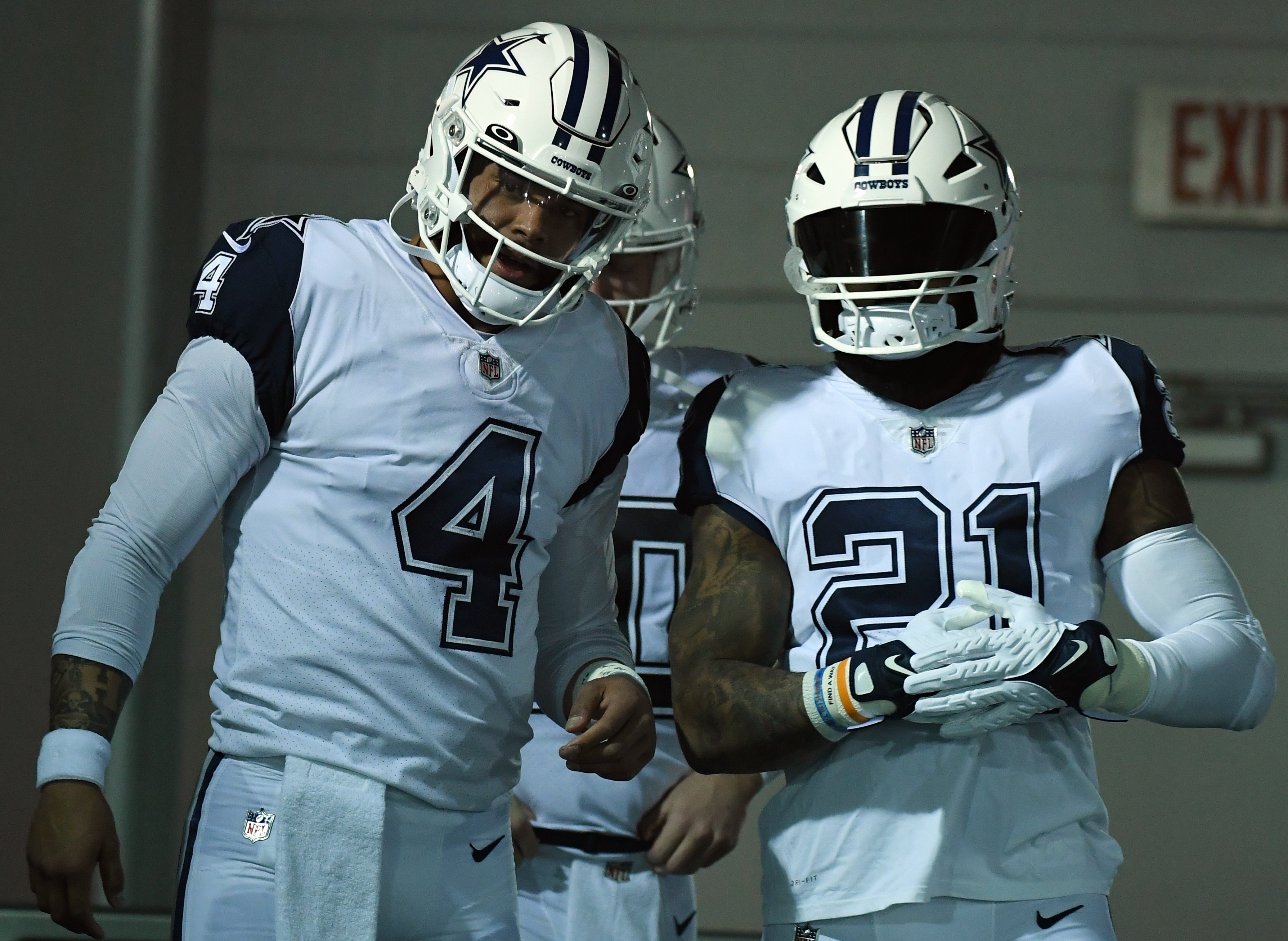 Dallas Cowboys quarterback Dak Prescott (4) and running back Ezekiel Elliott (21) wait to take the field before the game against the Tennessee Titans at Nissan Stadium.