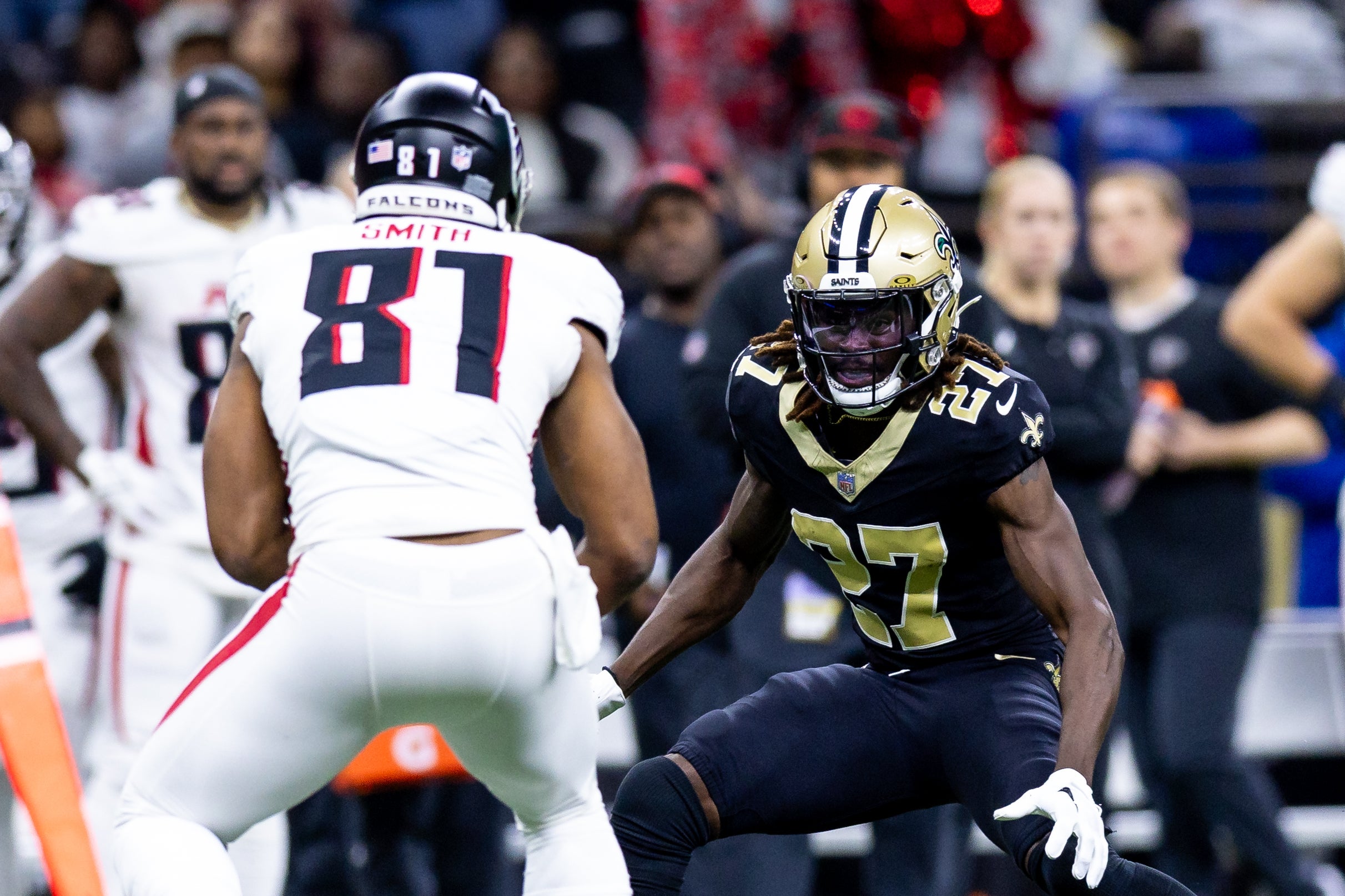 Jan 7, 2024; New Orleans, Louisiana, USA; Atlanta Falcons tight end Jonnu Smith (81) rushes against New Orleans Saints cornerback Isaac Yiadom (27) during the first half at Caesars Superdome.