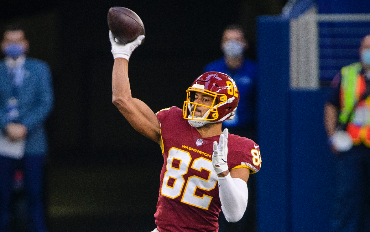 Nov 26, 2020; Arlington, Texas, USA; Washington Football Team tight end Logan Thomas (82) passes for a first down against the Dallas Cowboys during the first quarter at AT&T Stadium.