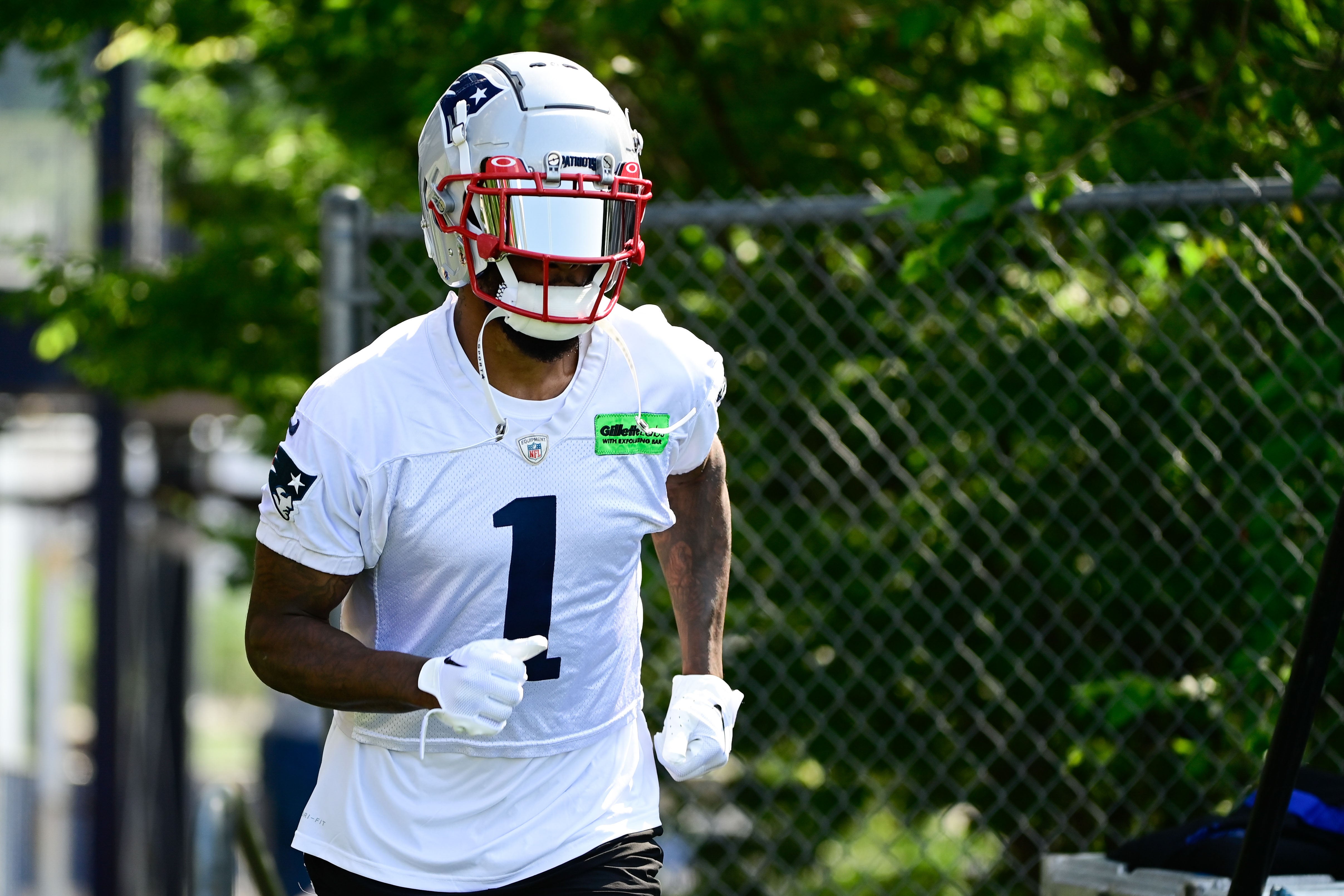 Jul 26, 2023; Foxborough, MA, USA; New England Patriots wide receiver DeVante Parker (1) makes his way to the practice fields for training camp at Gillette Stadium.