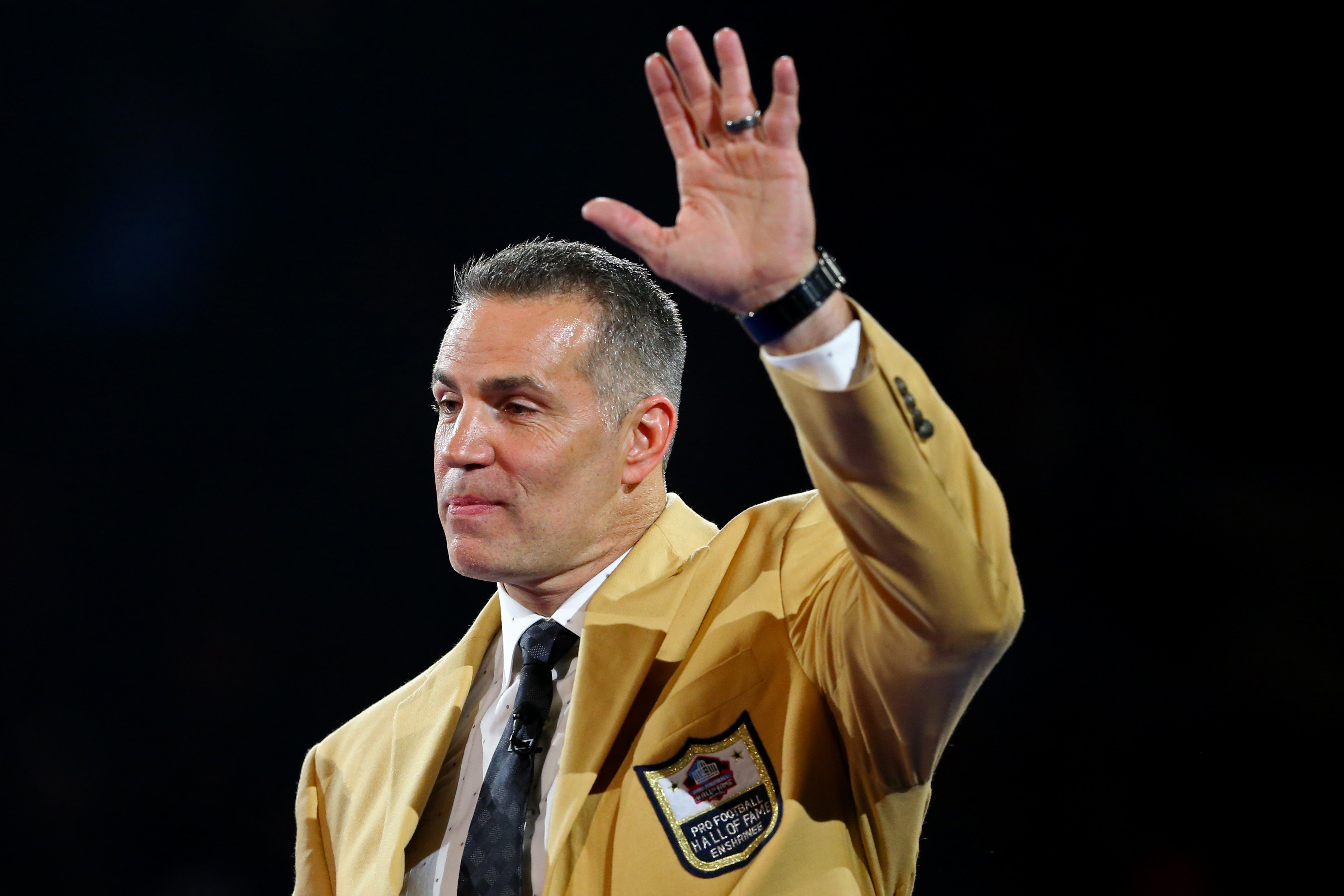 Aug 4, 2017; Canton, OH, USA; Kurt Warner waves during the Pro Football Hall of Fame Game-Enshrinees' Gold Jacket Dinner at Canton Memorial Civic Center.