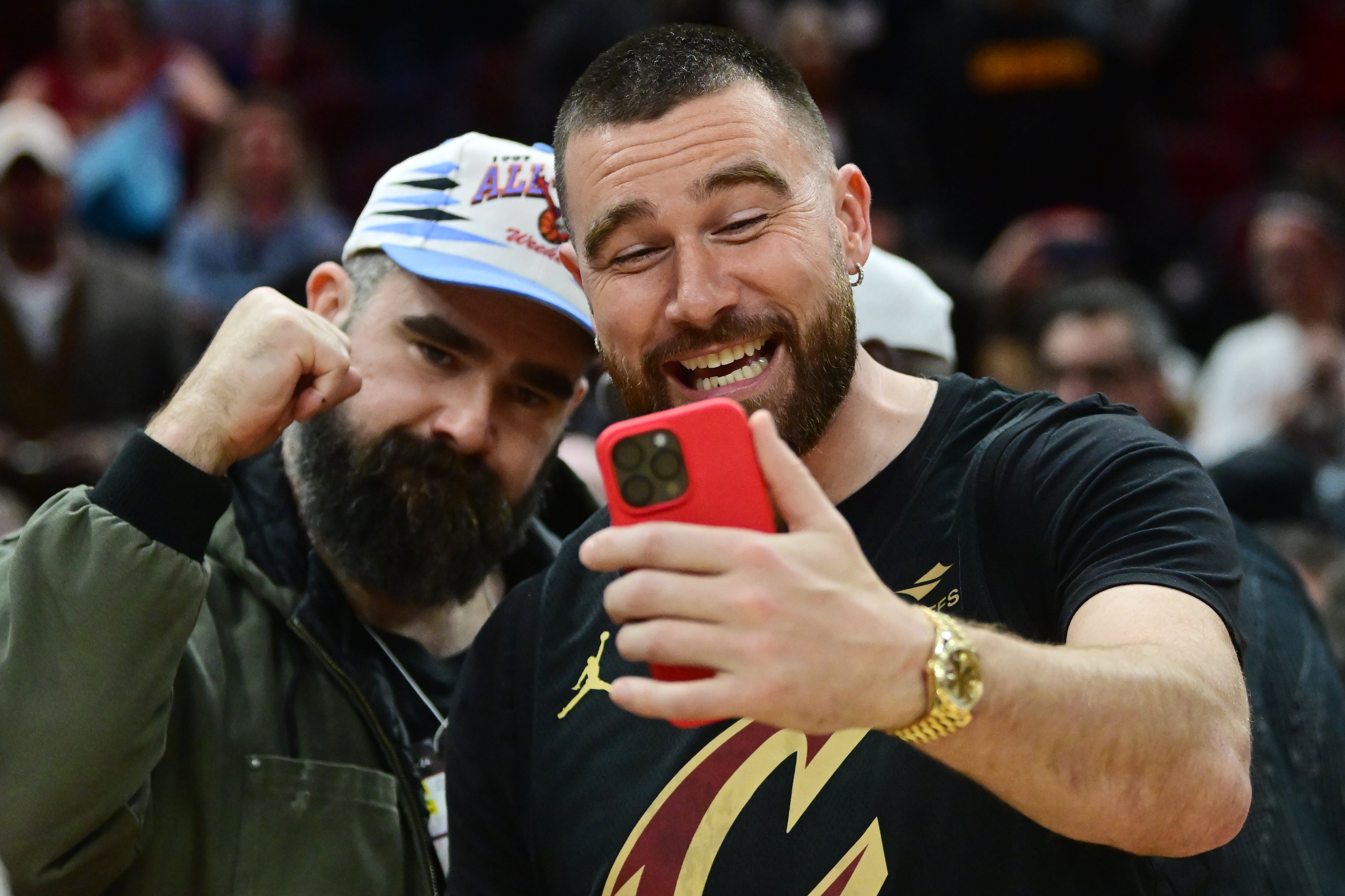 Mar 5, 2024; Cleveland, Ohio, USA; Cleveland natives and NFL players Travis, right, and Jason Kelce celebrate after the Cleveland Cavaliers beat the Boston Celtics during the second half at Rocket Mortgage FieldHouse.
