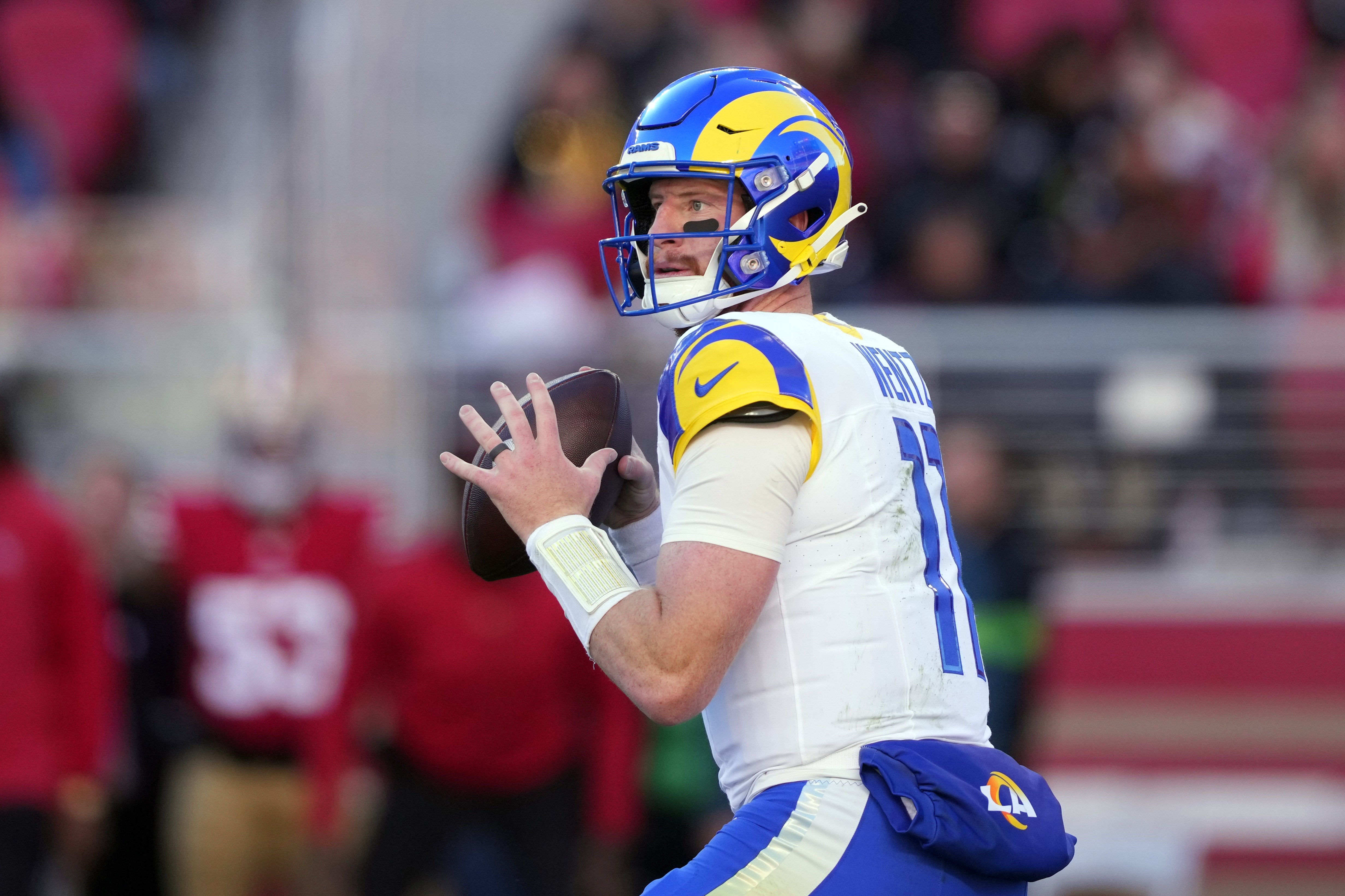 Jan 7, 2024; Santa Clara, California, USA; Los Angeles Rams quarterback Carson Wentz (11) against the San Francisco 49ers during the second quarter at Levi's Stadium.