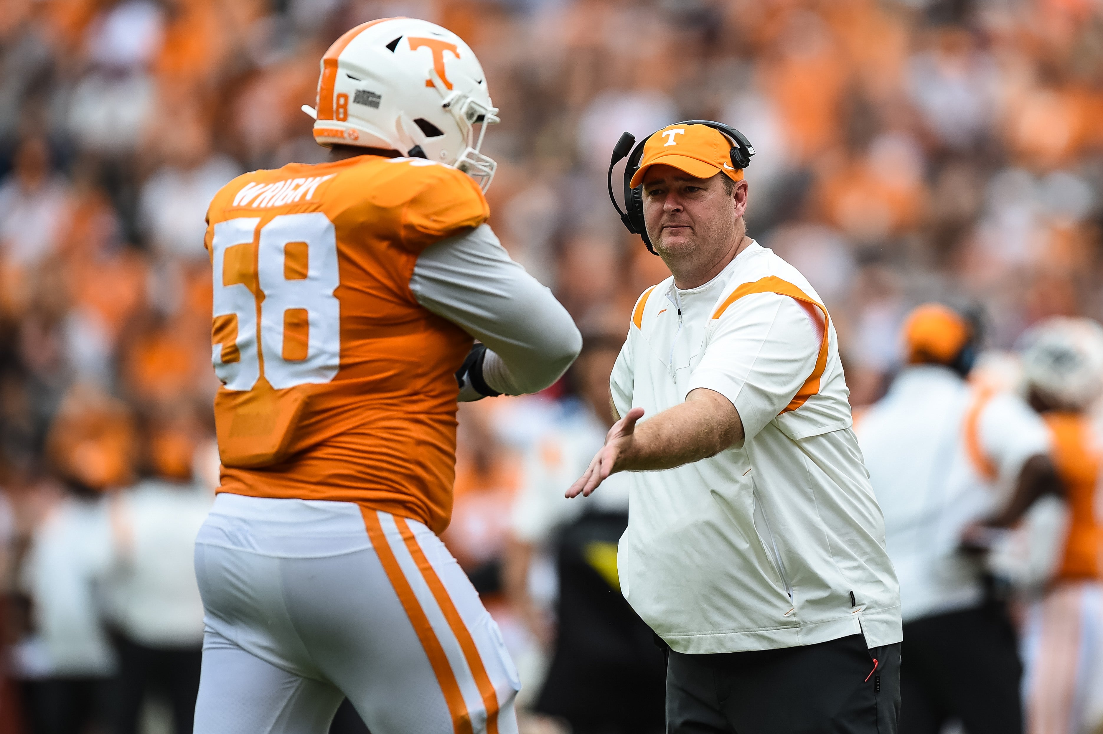 Sep 18, 2021; Knoxville, Tennessee, USA; Tennessee Volunteers head coach Josh Heupel congratulates Tennessee Volunteers offensive lineman Darnell Wright (58) during the first half against the Tennessee Tech Golden Eagles at Neyland Stadium.