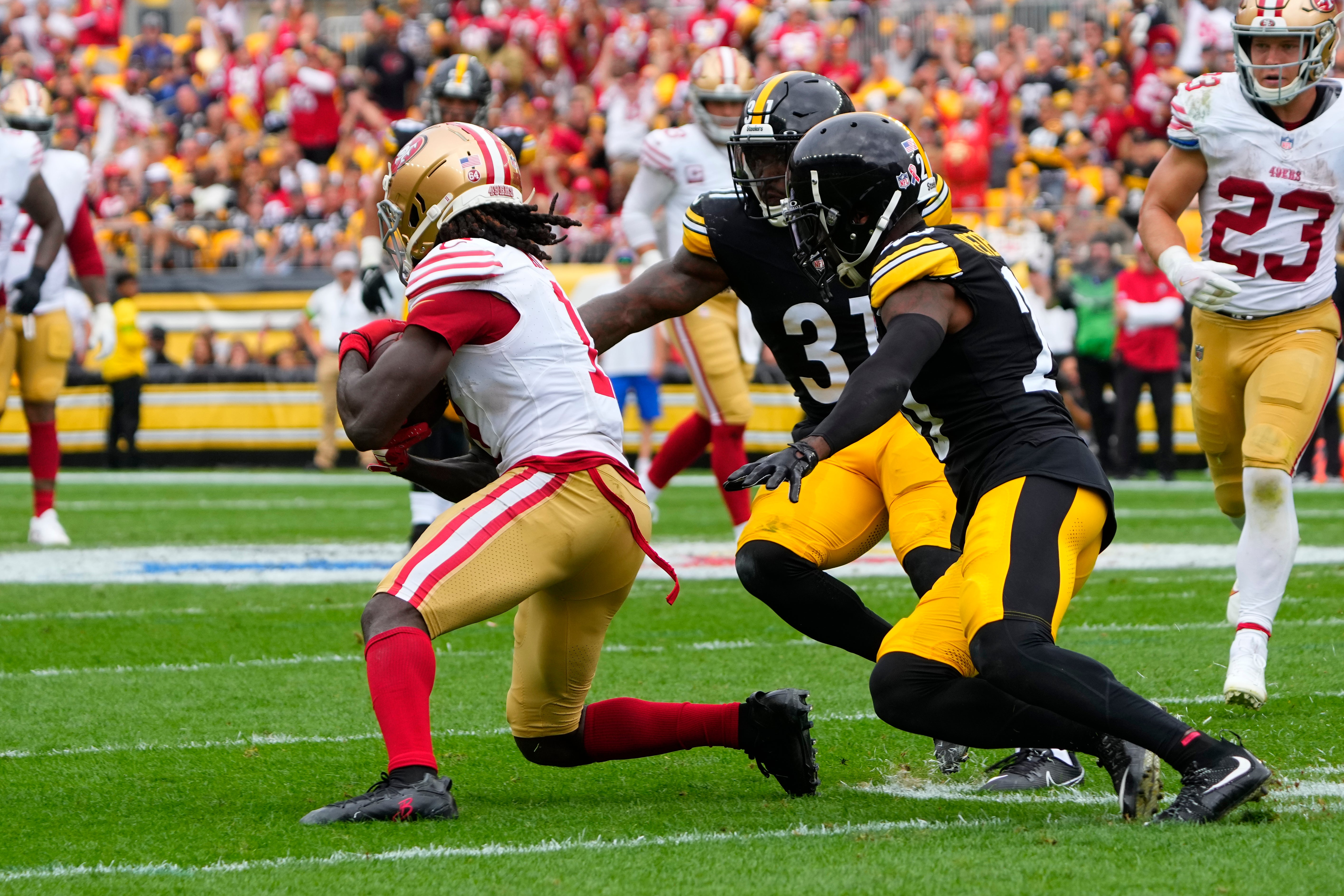 Sep 10, 2023; Pittsburgh, Pennsylvania, USA; Pittsburgh Steelers cornerback Patrick Peterson (20) and safety Keanu Neal (31) defend against San Francisco 49ers wide receiver Brandon Aiyuk (11) during the first half at Acrisure Stadium. Mandatory Credit: Gregory Fisher-USA TODAY Sports