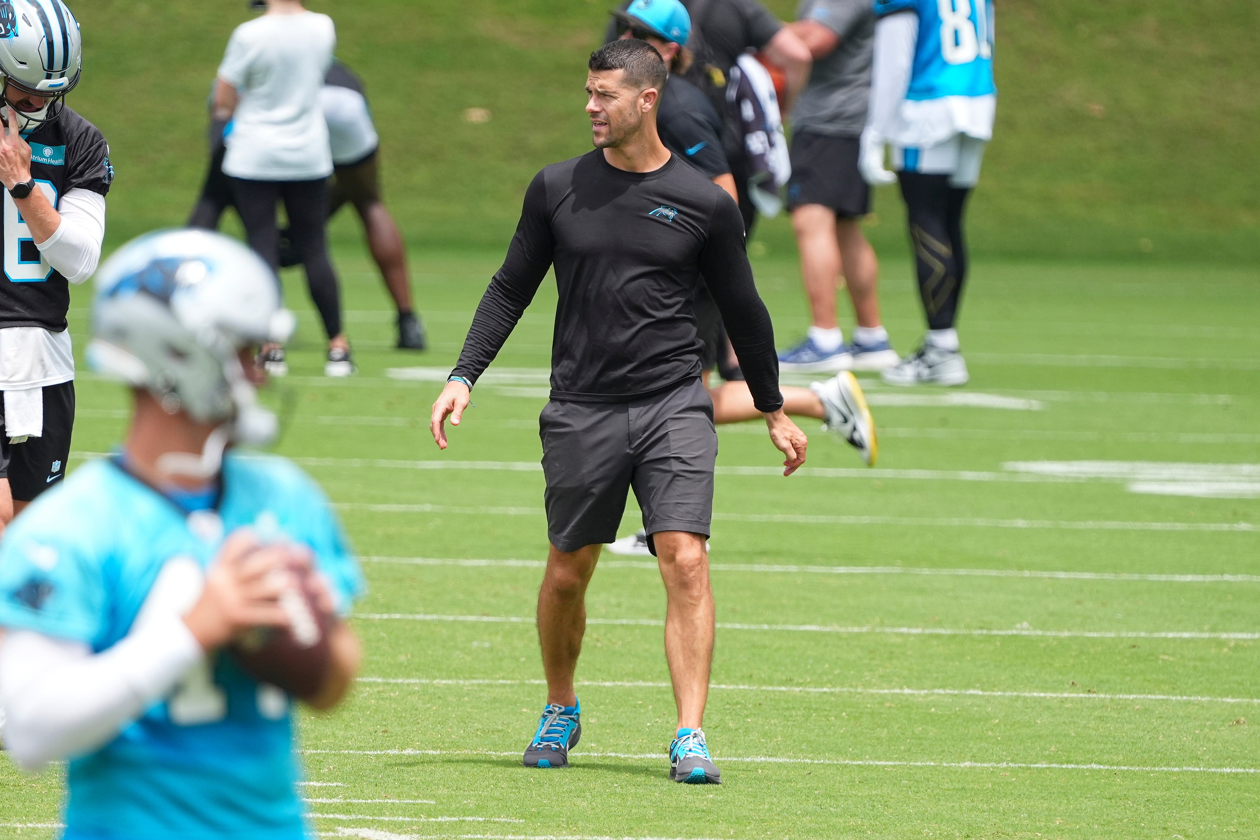 Jun 4, 2024; Charlotte, NC, USA; Carolina Panthers Head Coach Dave Canales looks at his offensive backfield during OTAs. Mandatory Credit: Jim Dedmon-USA TODAY Sports