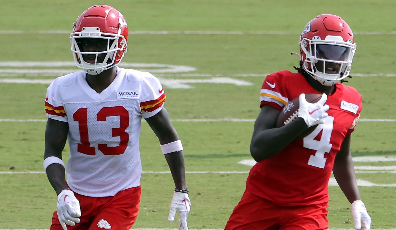 ST JOSEPH, MISSOURI - JULY 25: Wide receiver Rashee Rice #4 of the Kansas City Chiefs carries the ball after making a catch as safety Nazeeh Johnson #13 defends during Kansas City Chiefs Training Camp on July 25, 2023 in St Joseph, Missouri.