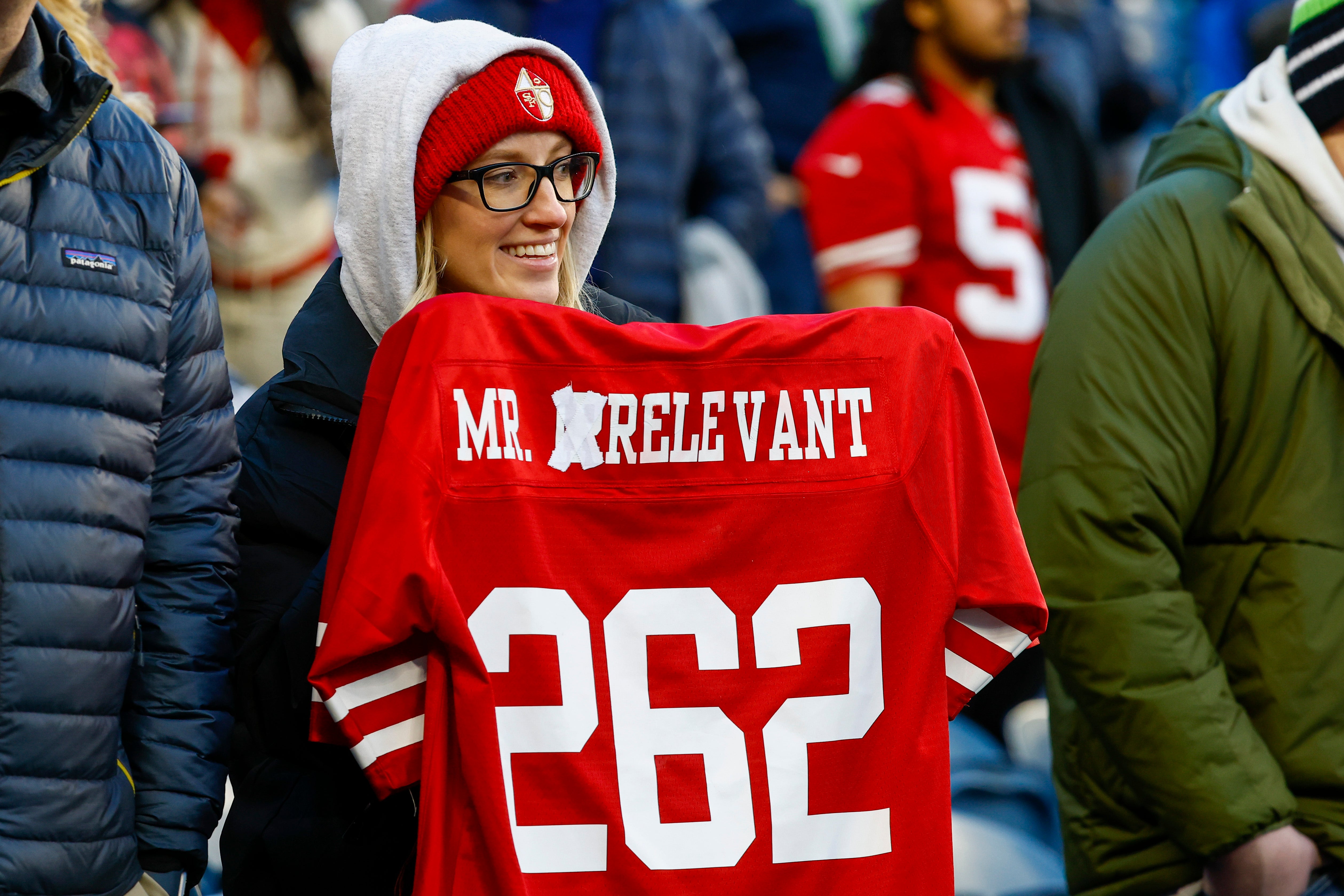 Dec 15, 2022; Seattle, Washington, USA; A fan holds an altered Mr. Irrelevant jersey for San Francisco 49ers quarterback Brock Purdy (not pictured) during pregame warmups against the Seattle Seahawks at Lumen Field. Mr. Irrelevant refers to the final pick of the NFL draft.