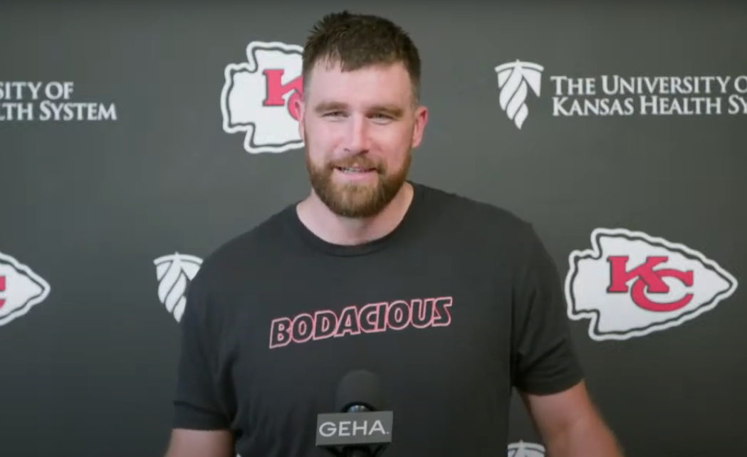 Travis Kelce speaks to media members.