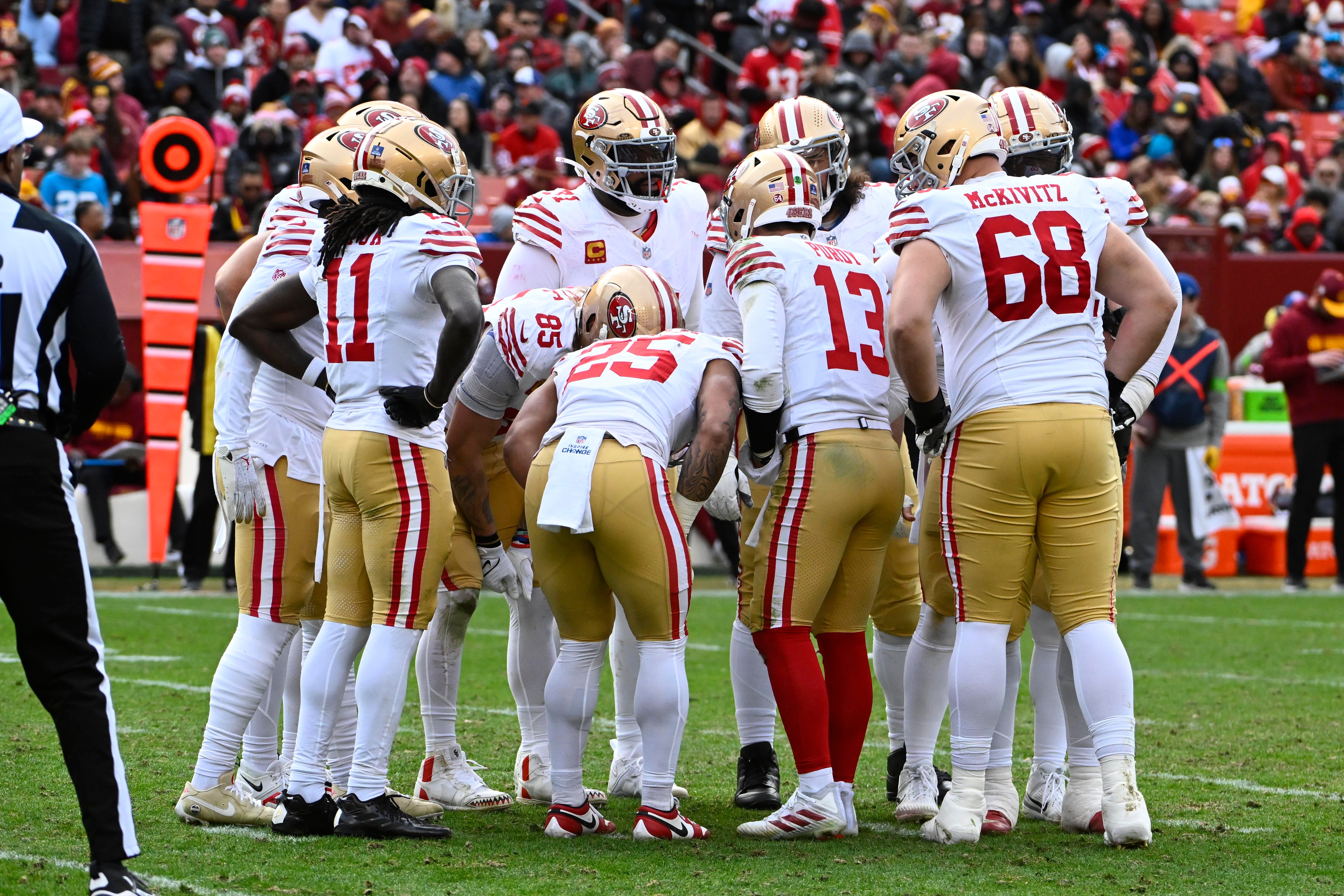 Dec 31, 2023; Landover, Maryland, USA; San Francisco 49ers huddle against the Washington Commanders during the second half at FedExField.