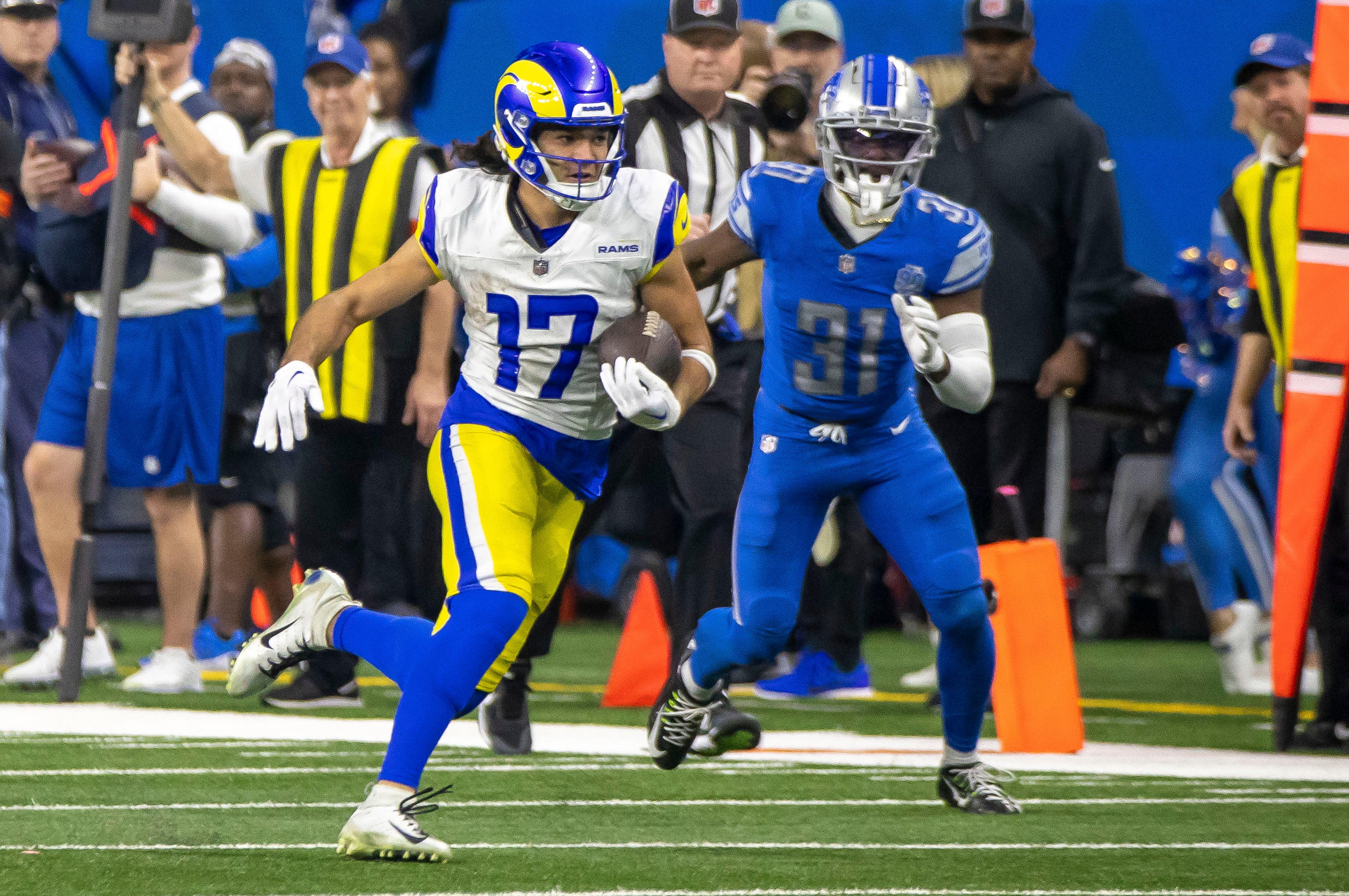 Jan 14, 2024; Detroit, Michigan, USA; Los Angeles Rams wide receiver Puka Nacua (17) runs from Detroit Lions safety Kerby Joseph (31) during the second half of a 2024 NFC wild card game at Ford Field.