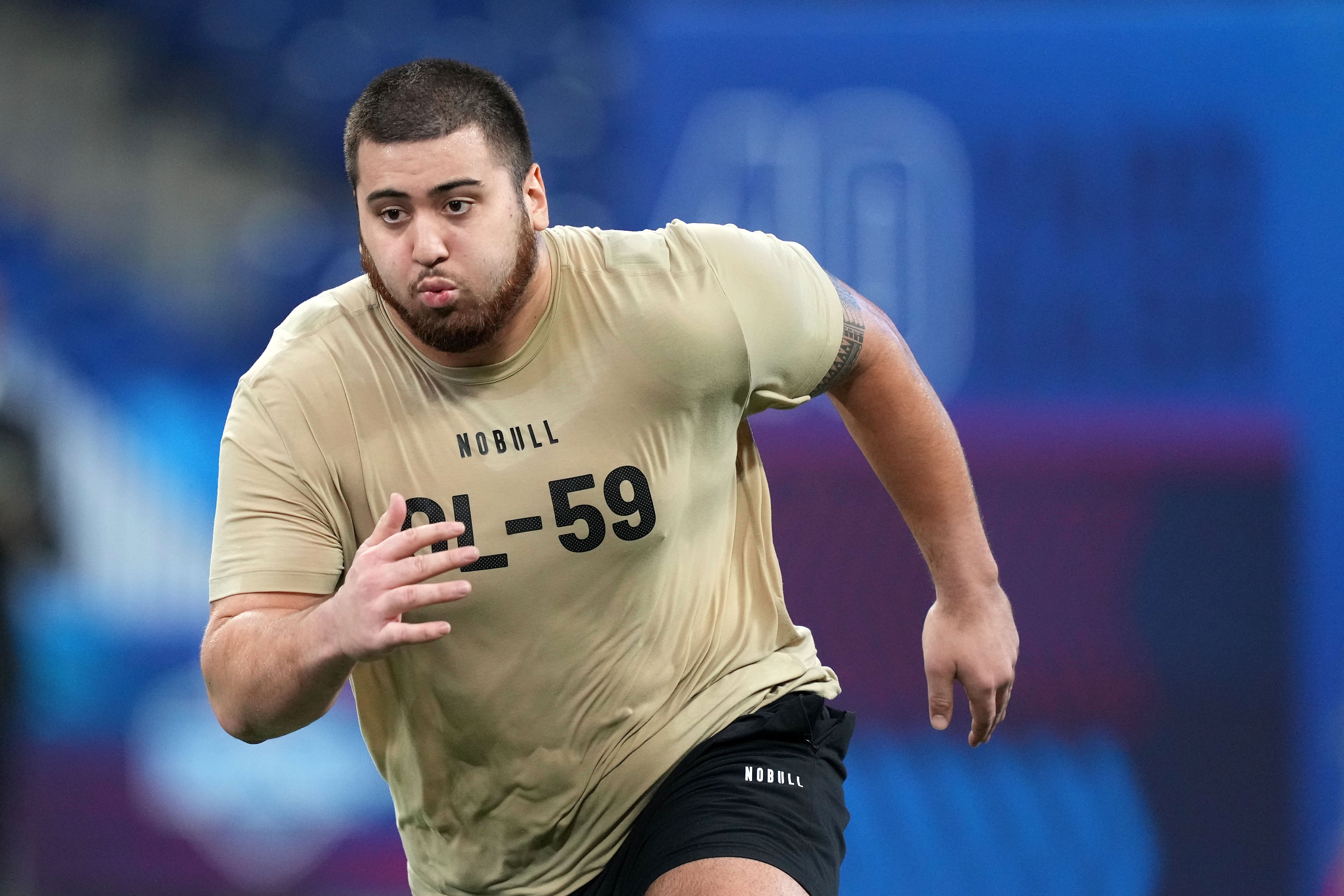 Mar 3, 2024; Indianapolis, IN, USA; Kansas offensive lineman Dominick Puni (OL59) during the 2024 NFL Combine at Lucas Oil Stadium.