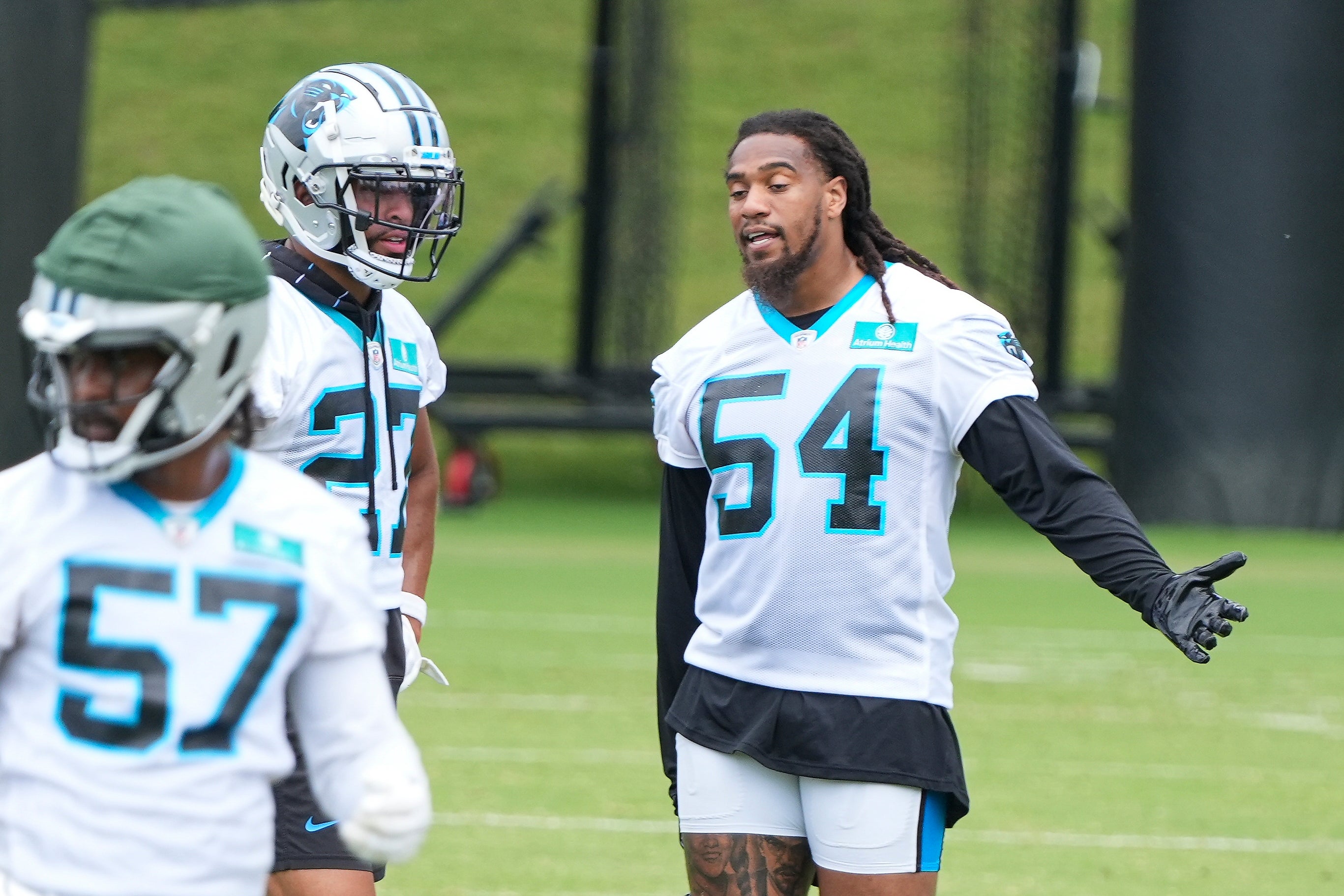 Jun 4, 2024; Charlotte, NC, USA; Carolina Panthers safety Alex Cook (27) and linebacker Shaq Thompson (54) talk during OTAs. Mandatory Credit: Jim Dedmon-USA TODAY Sports
