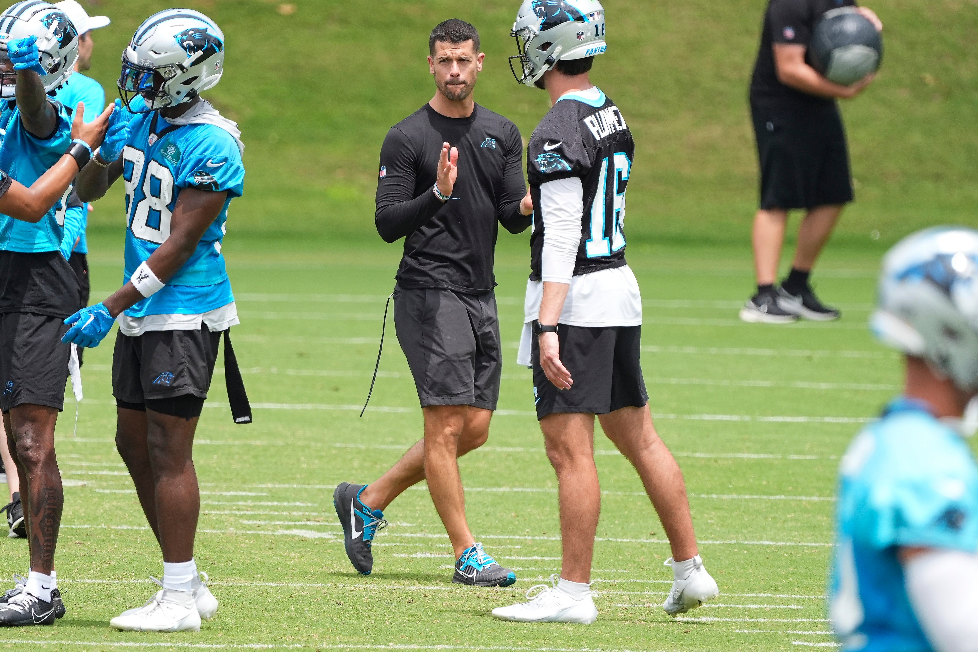 Jun 4, 2024; Charlotte, NC, USA; Carolina Panthers Head Coach Dave Canales claps watching offensive drills during OTAs. Mandatory Credit: Jim Dedmon-USA TODAY Sports